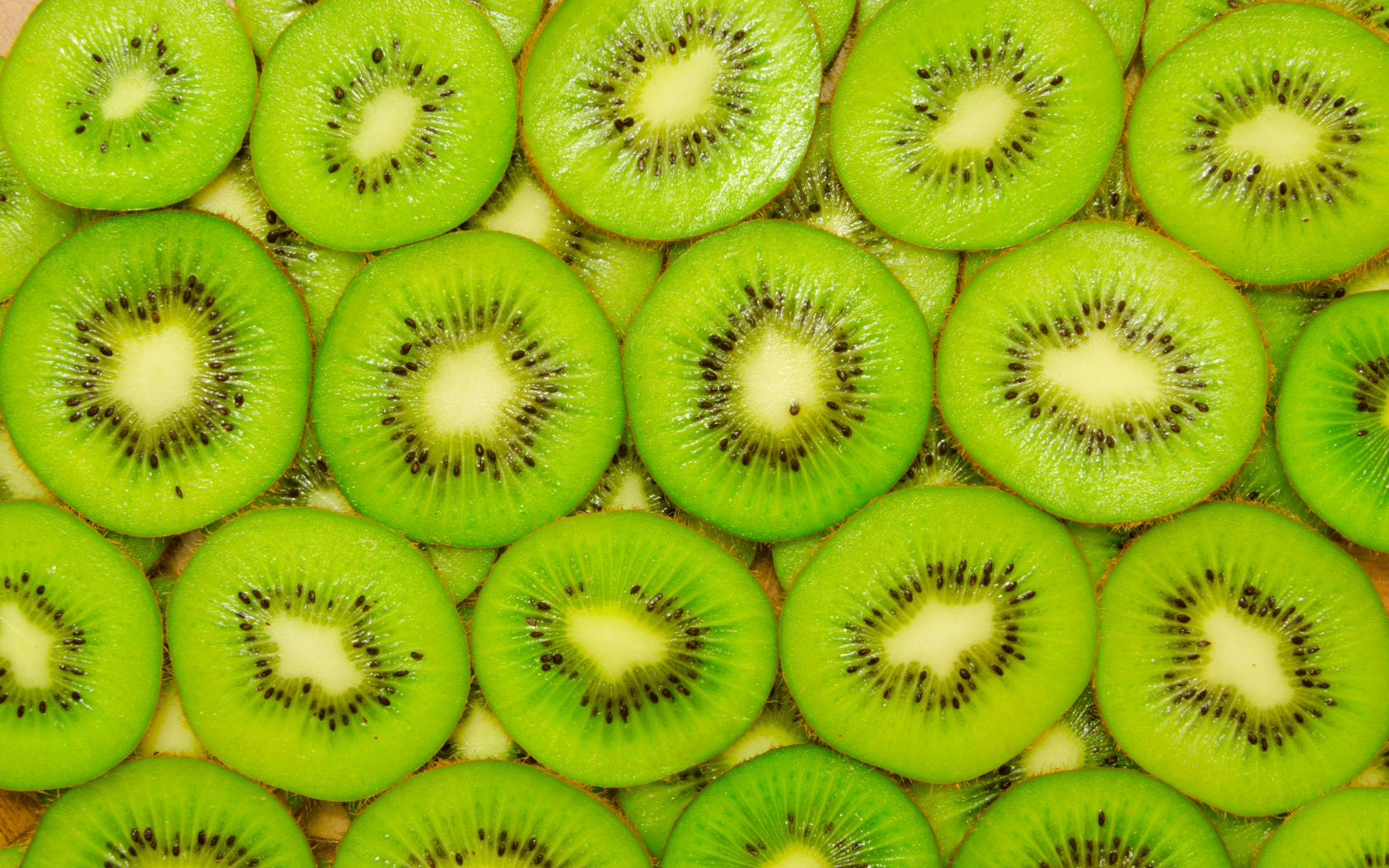 Фон из сочных кусочков киви крупным планом
