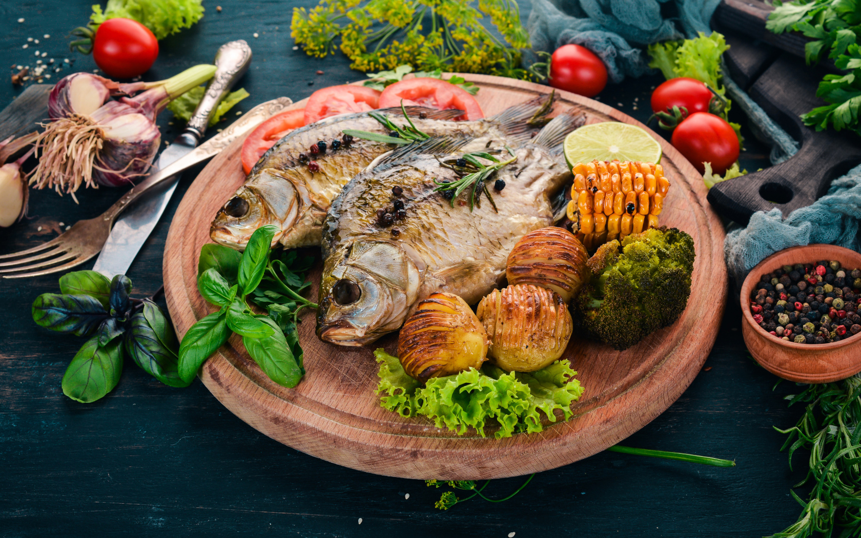 Grilled fish on a board with vegetables