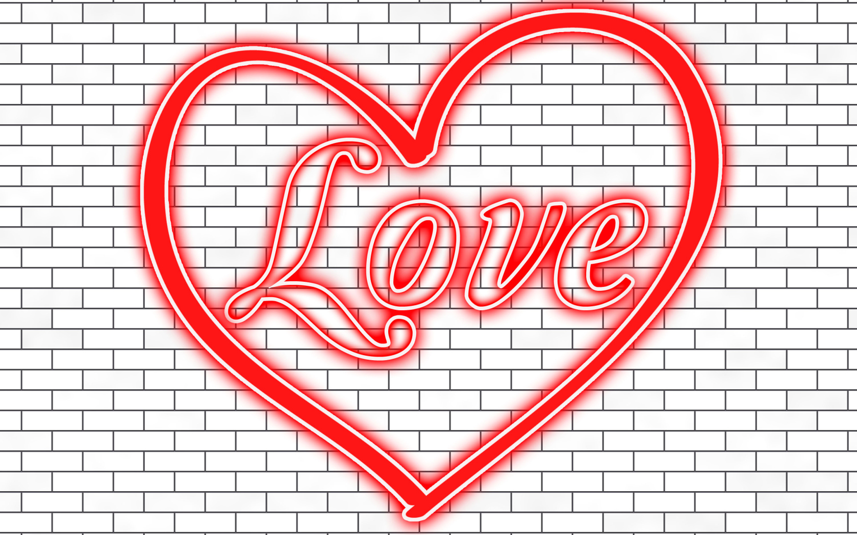 Красное сердце с надписью Любовь на кирпичной стене