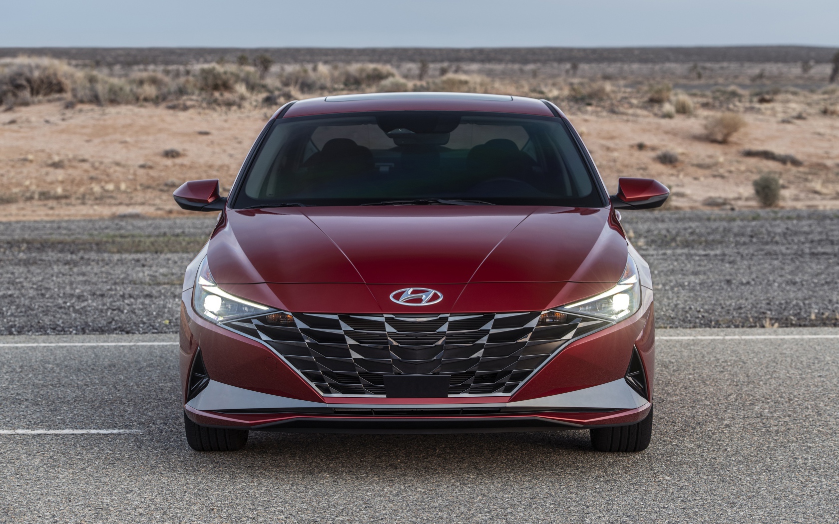 Красный автомобиль  Hyundai Elantra, 2021 года на пустыре