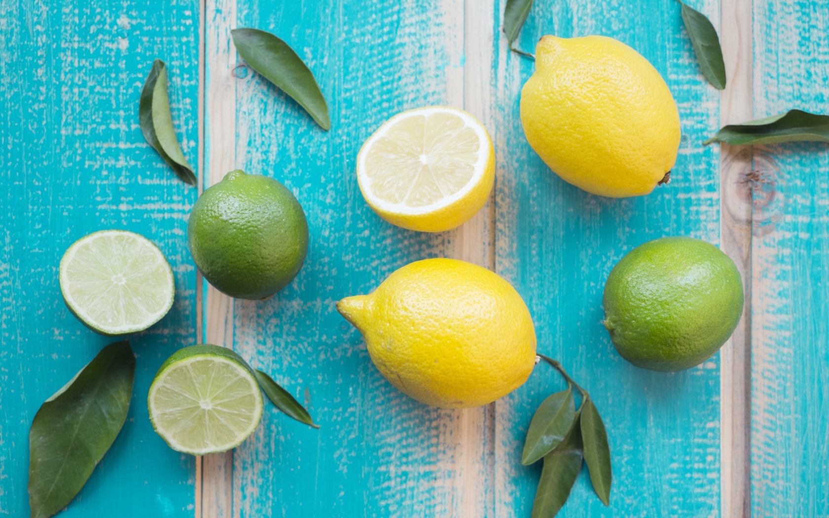 Yellow lemons and green lime fruits on the table