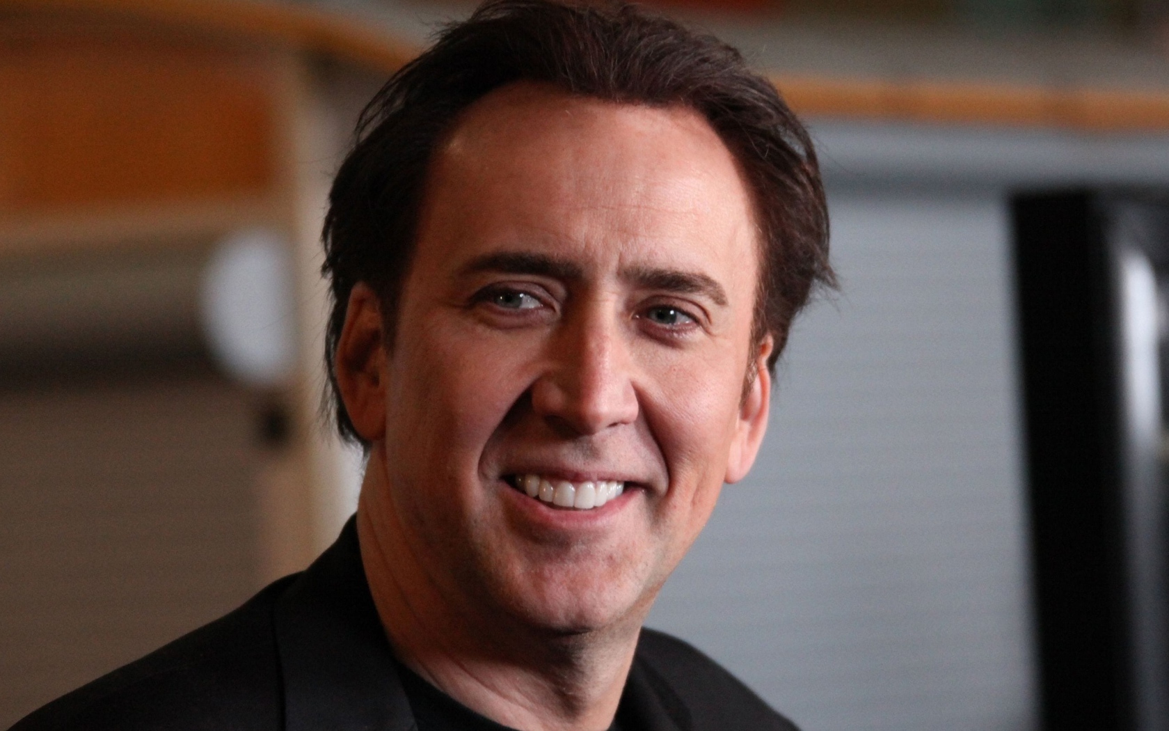 Улыбающийся мужчина,  актер Николас Кейдж