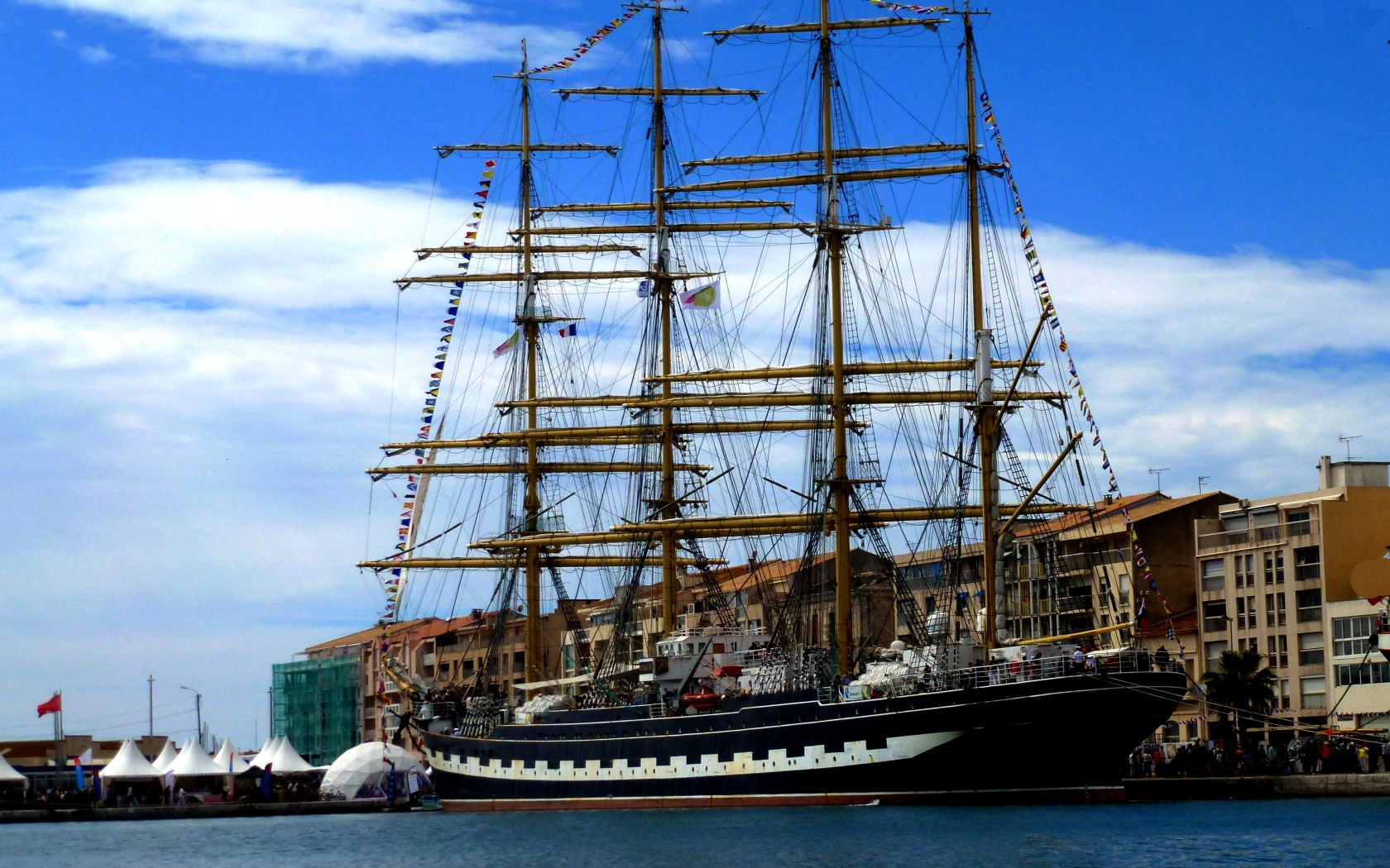 Large sailing frigate in the port against the sky