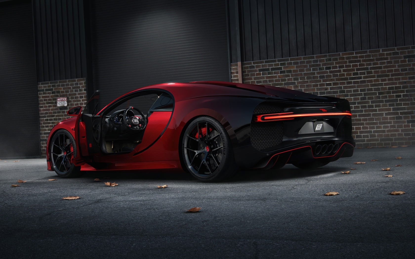 Красный дорогой автомобиль Bugatti Chiron вид сзади