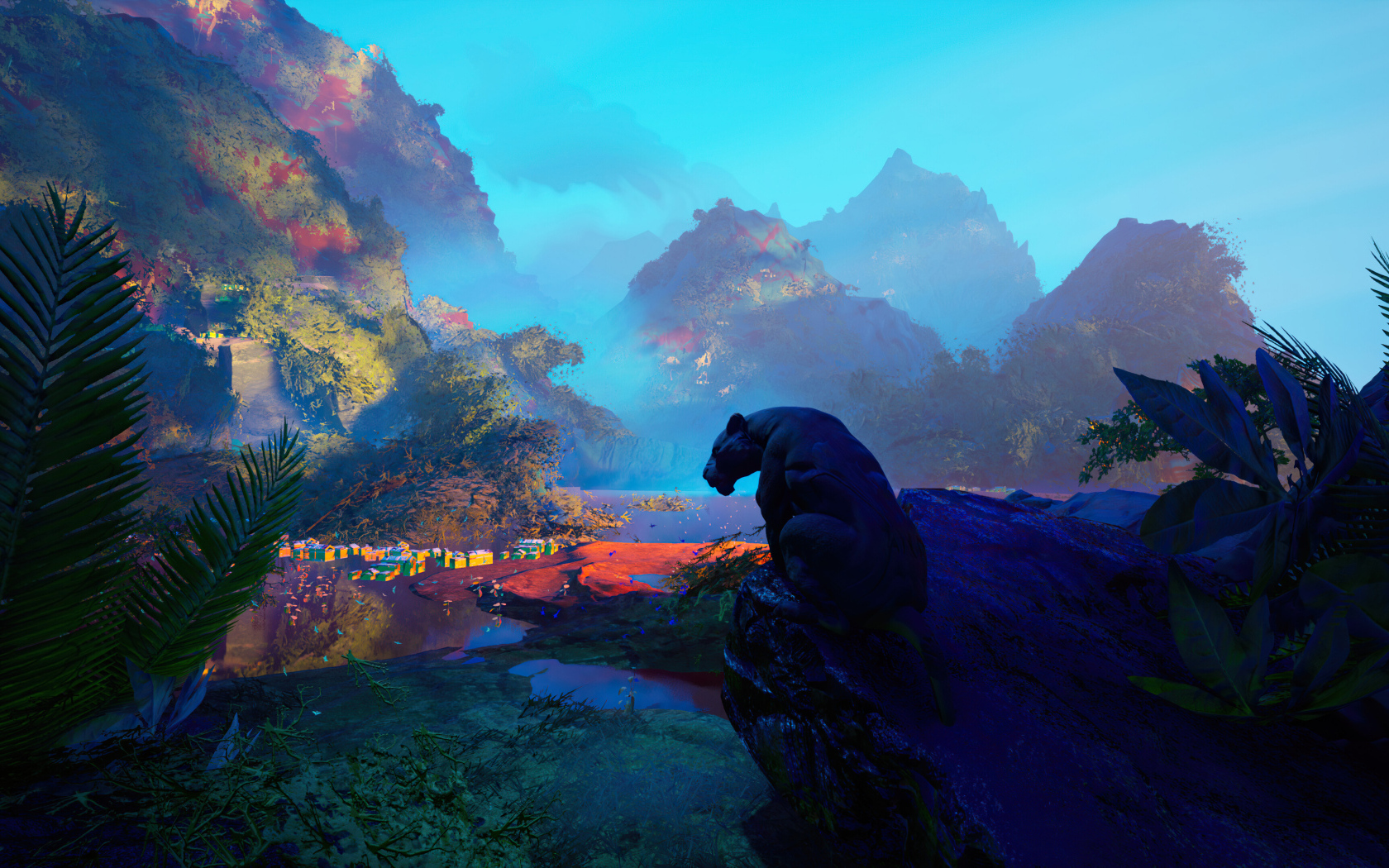 Большая черная пантера сидит на камне