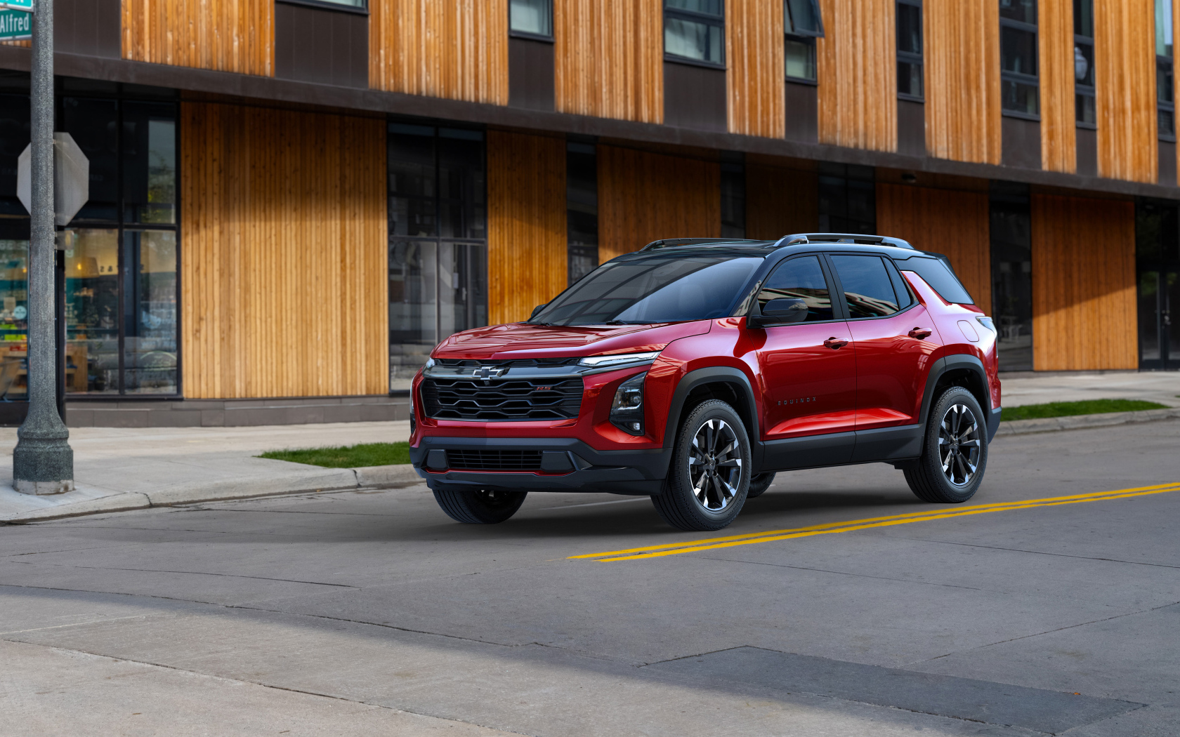 Красный автомобиль Chevrolet Equinox RS 2025 года