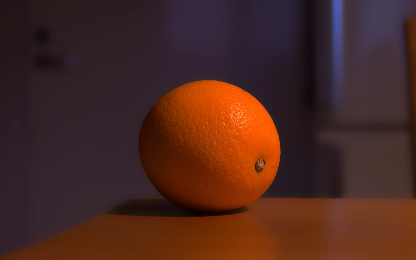 Один оранжевый апельсин лежит на столе