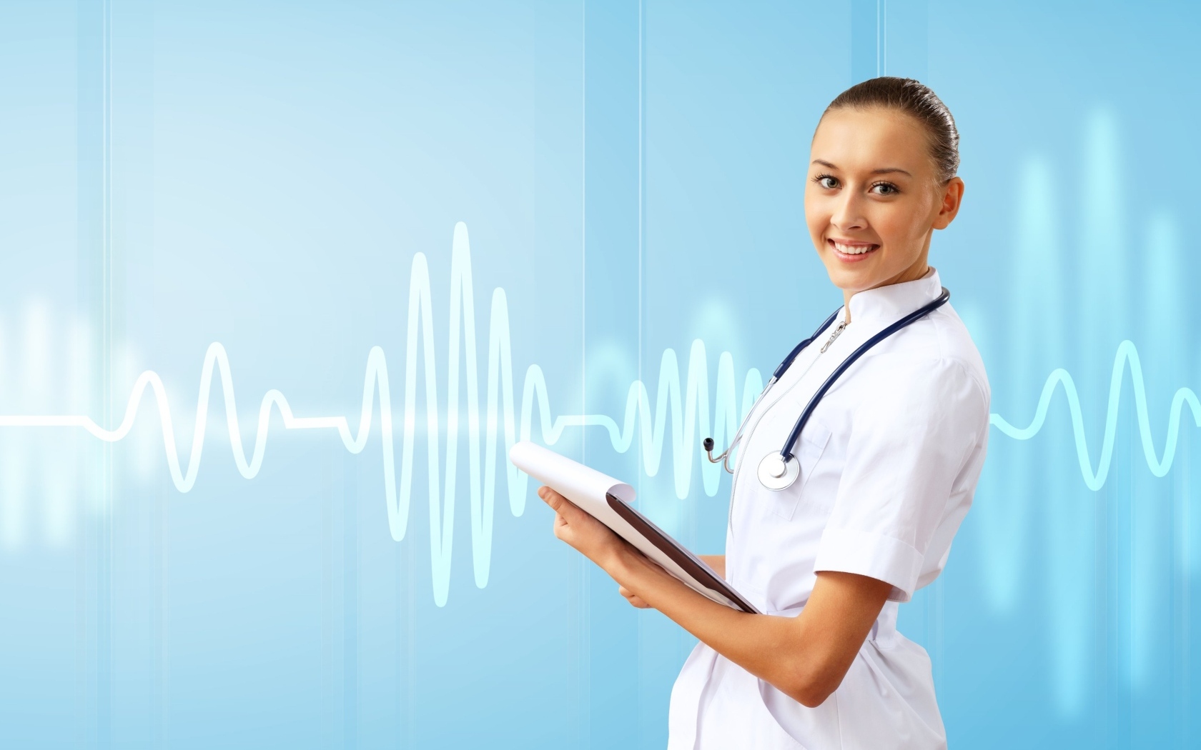 Девушка врач на фоне кардиограммы