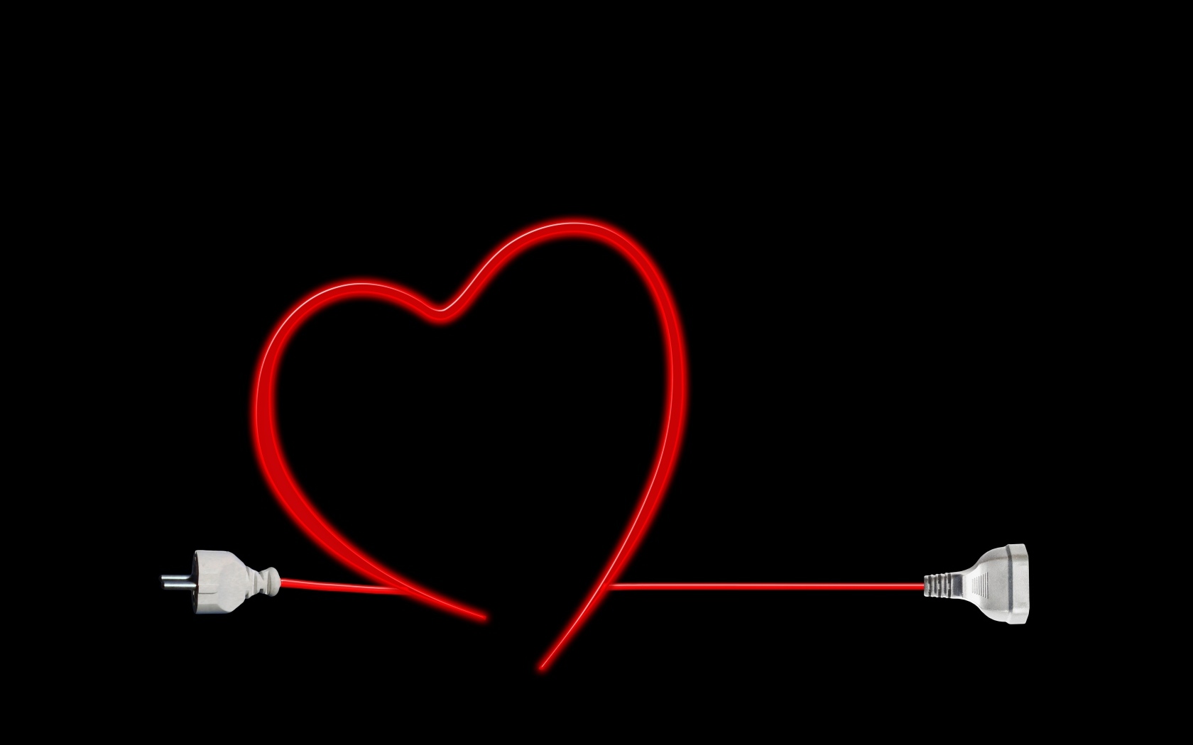 Красное сердце из провода на черном фоне