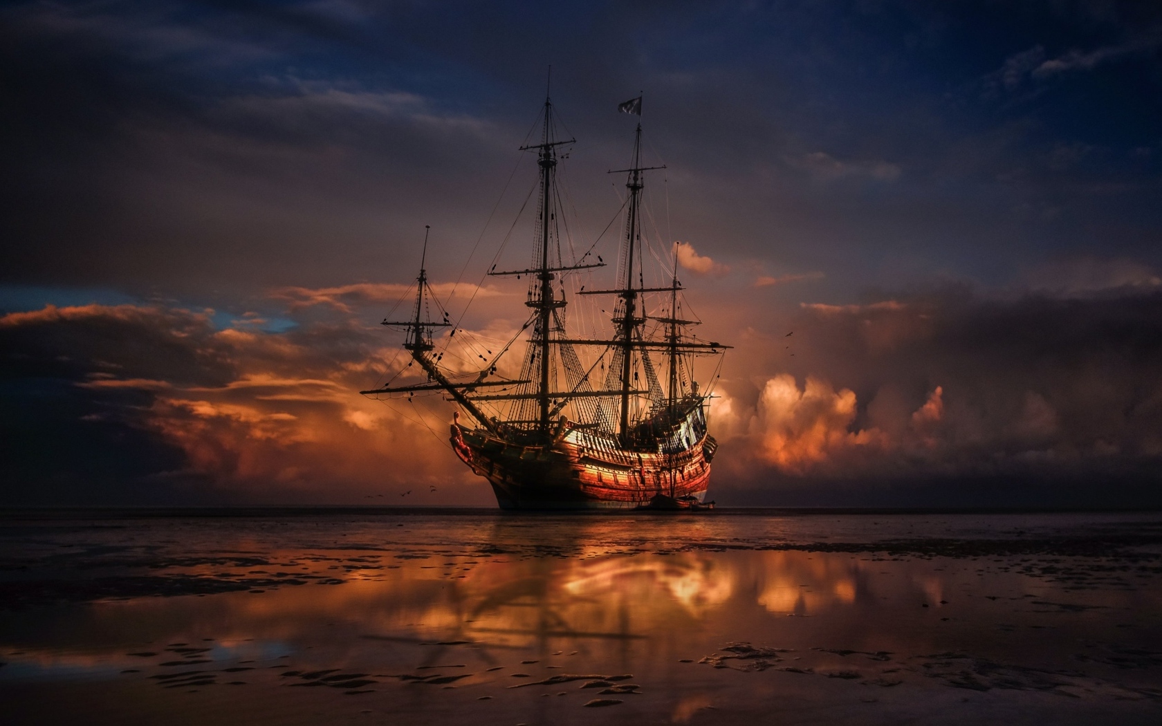 Большой корабль идет на мель на закате