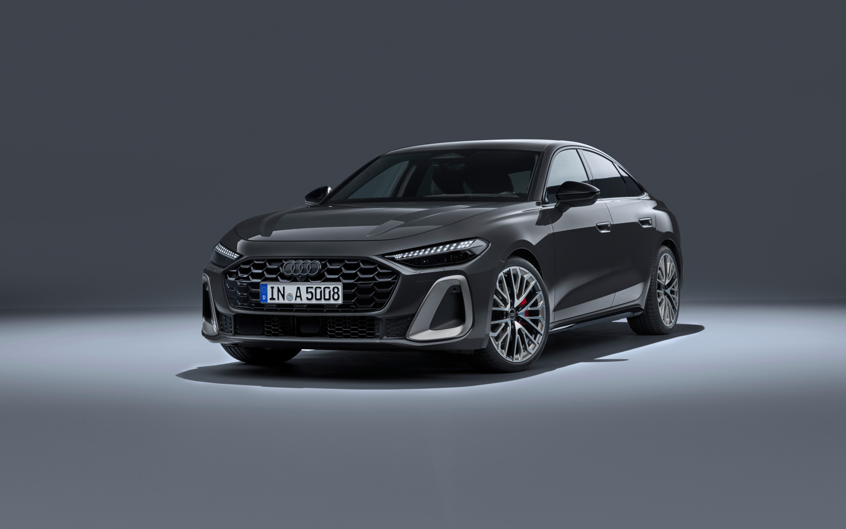 Автомобиль Audi A5 TFSI quattro S line 2024 года на сером фоне