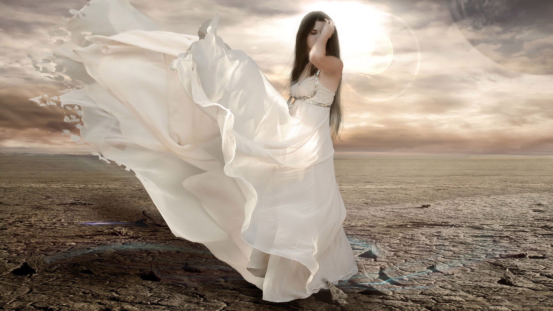 Girl in a white dress in the desert
