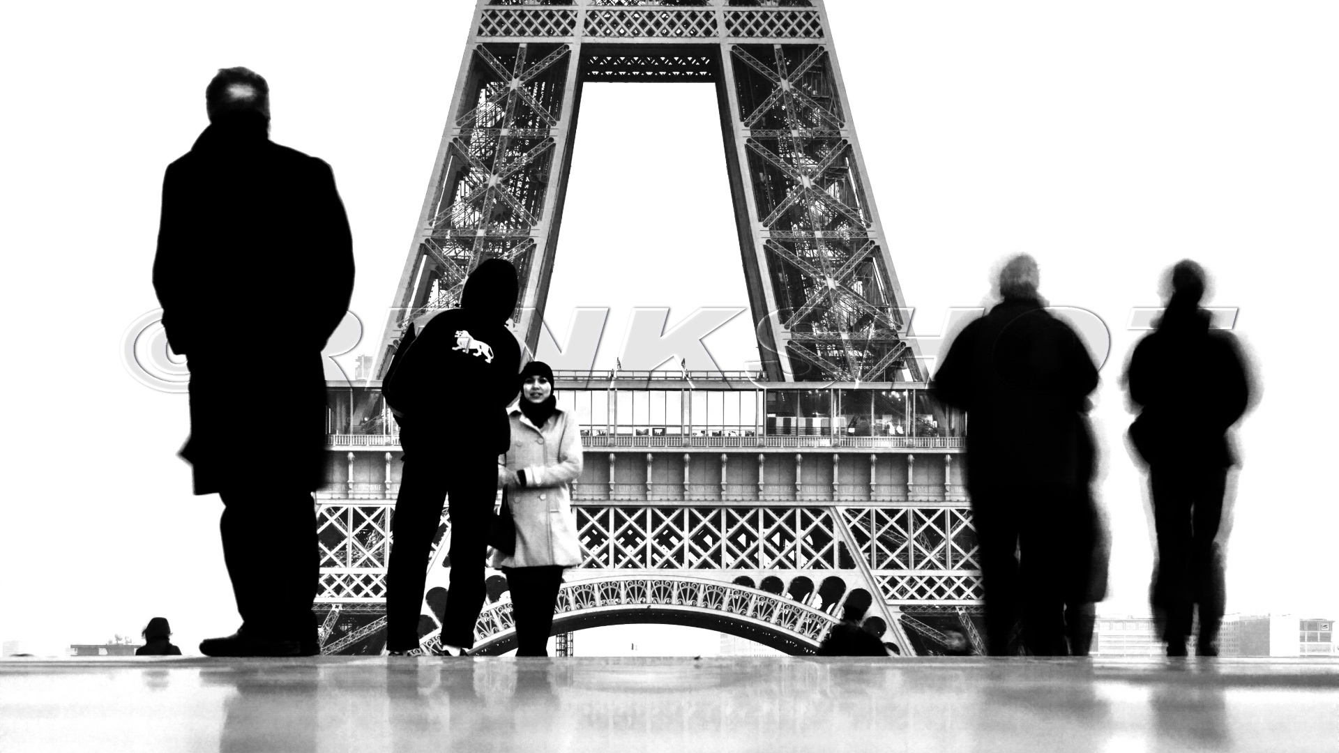 People on the background of the Eiffel Tower, black and white photo