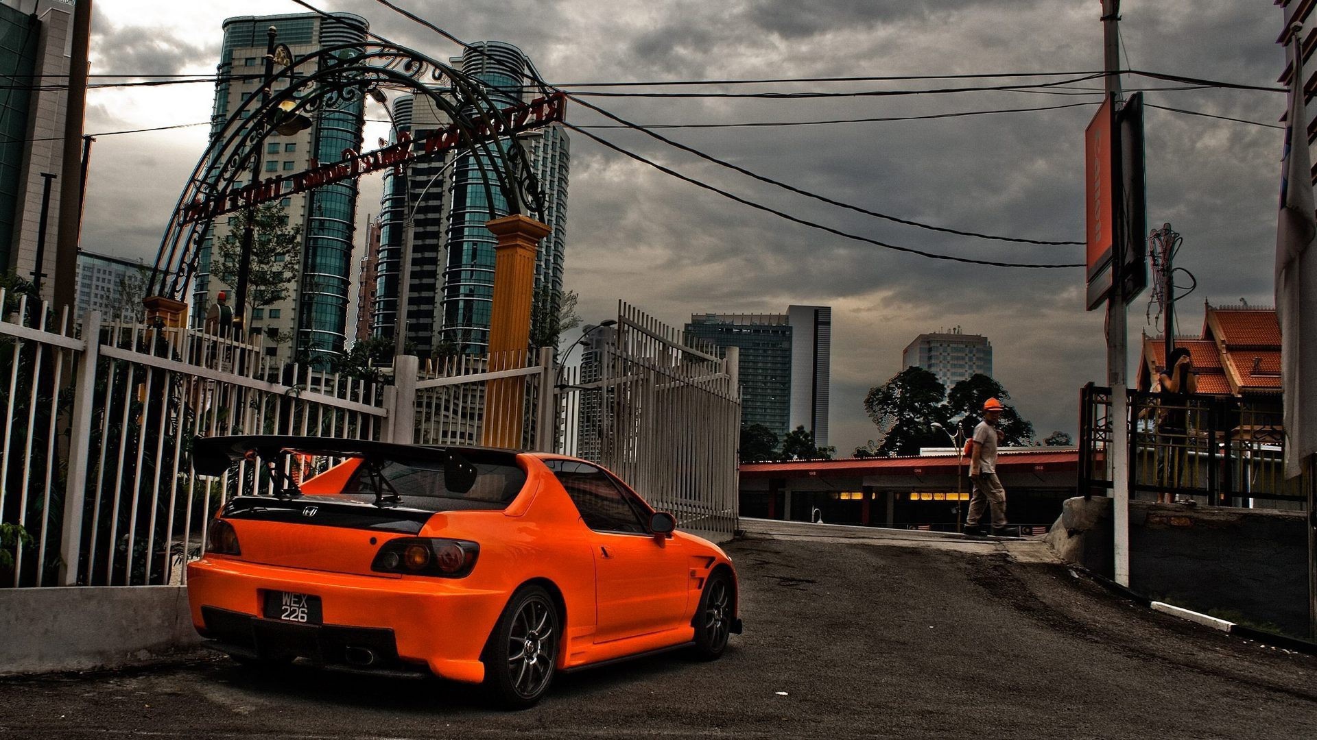 Orange Honda parked in the city