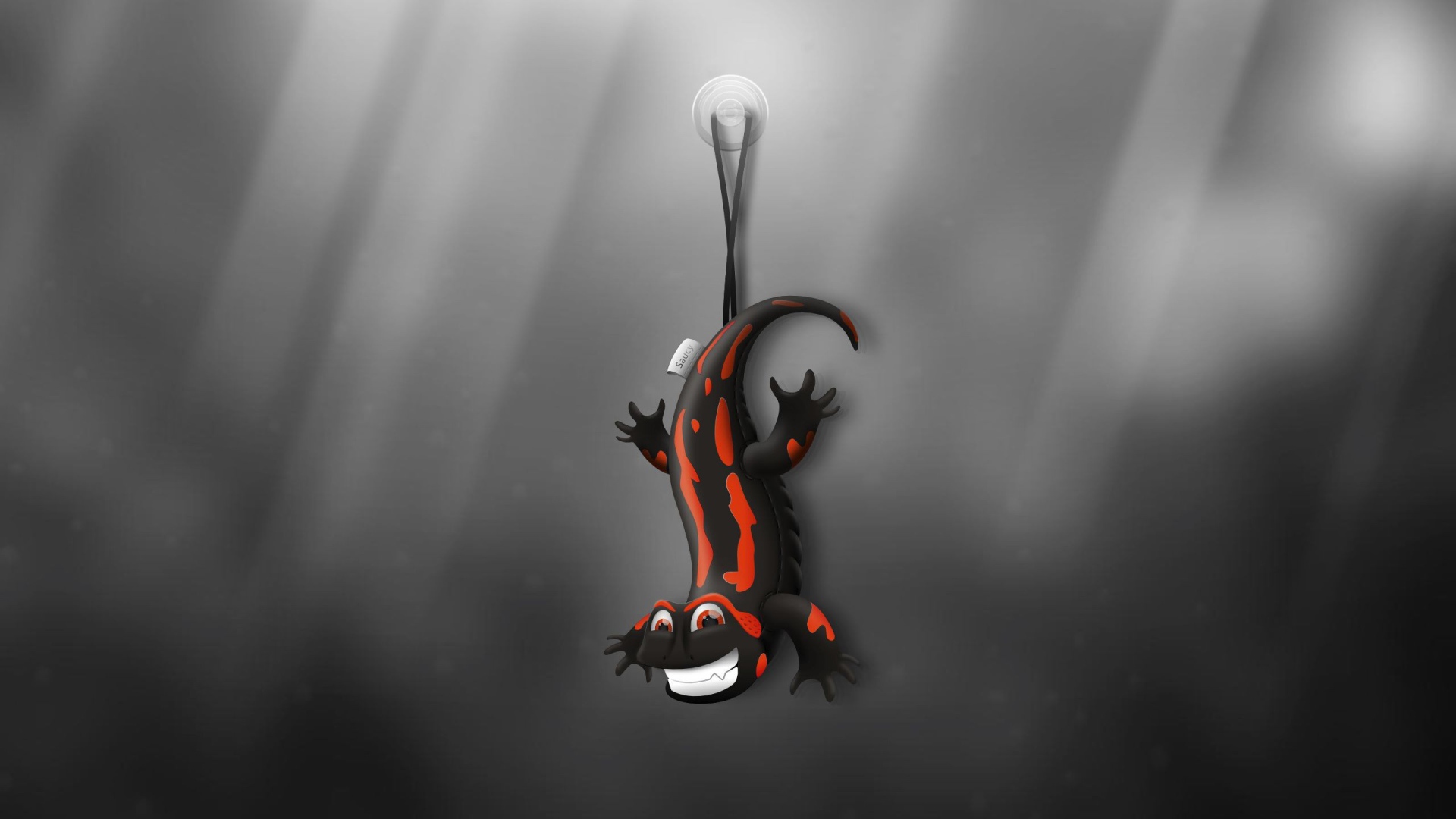 Ящерица игрушка, серый фон