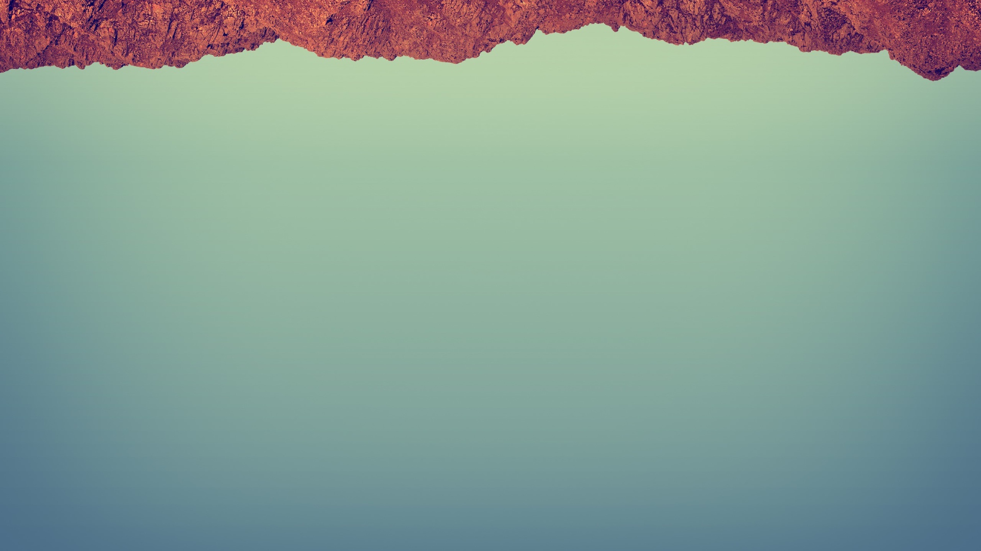 Красный камень на сером фоне