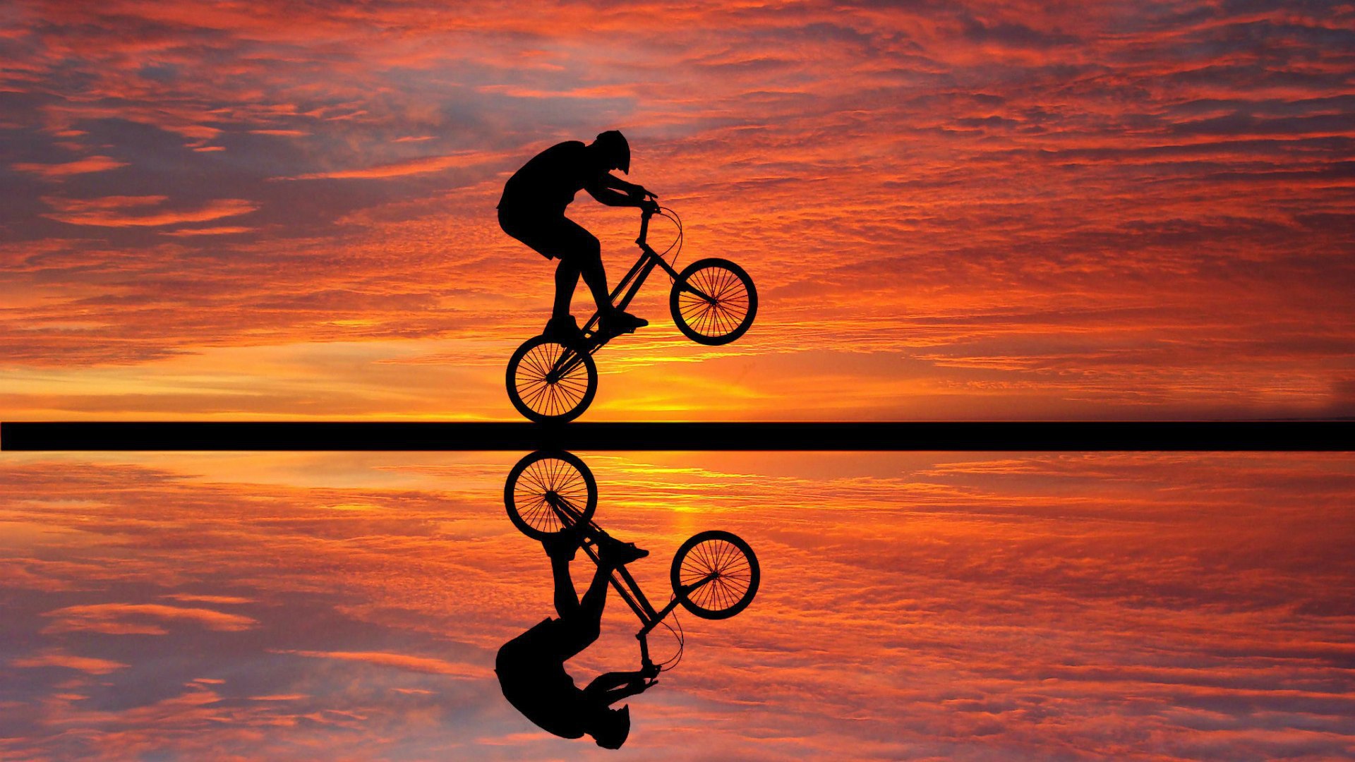 Biking on sunset background