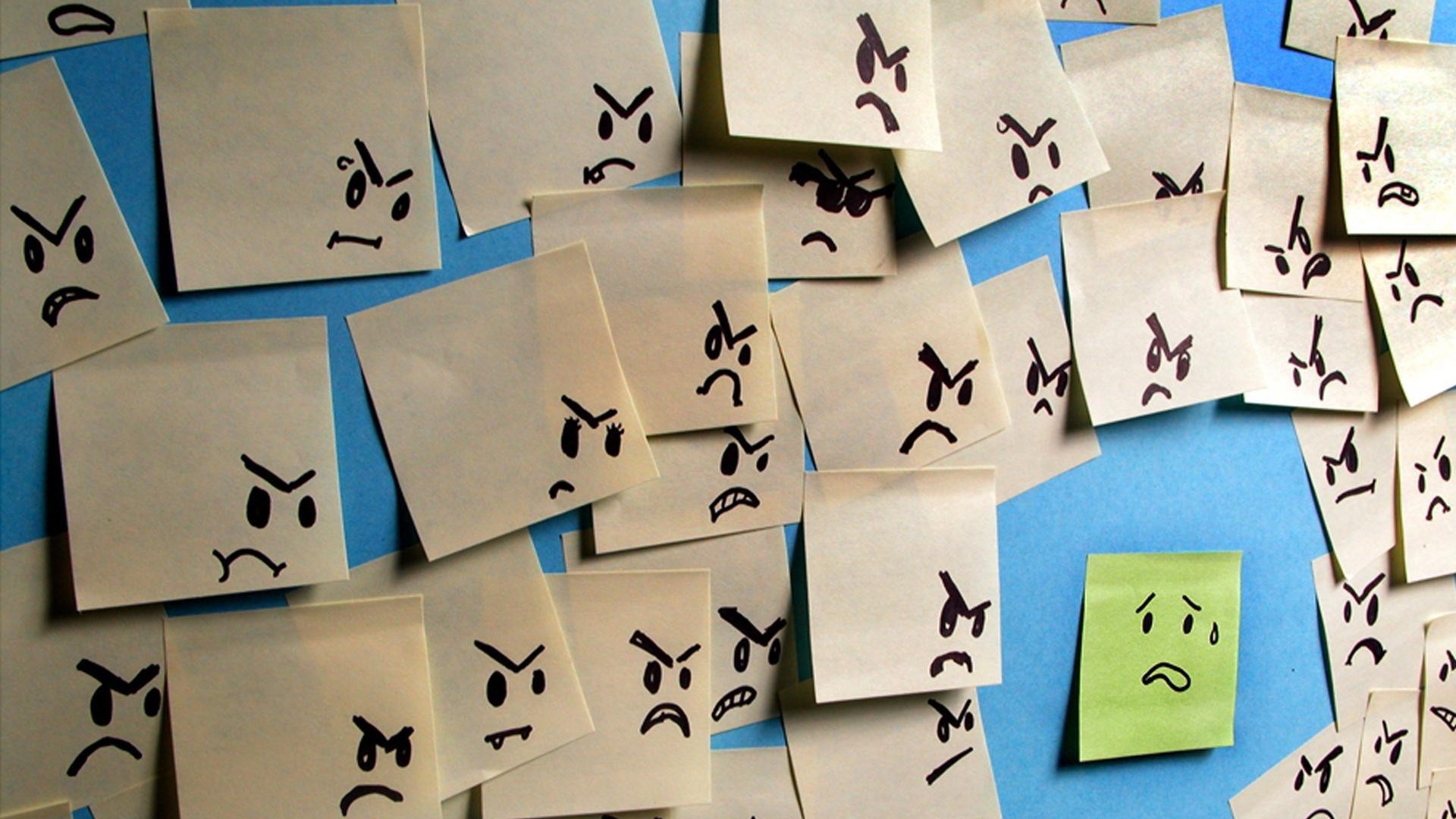 Испуганный стикер в окружении злых стикеров