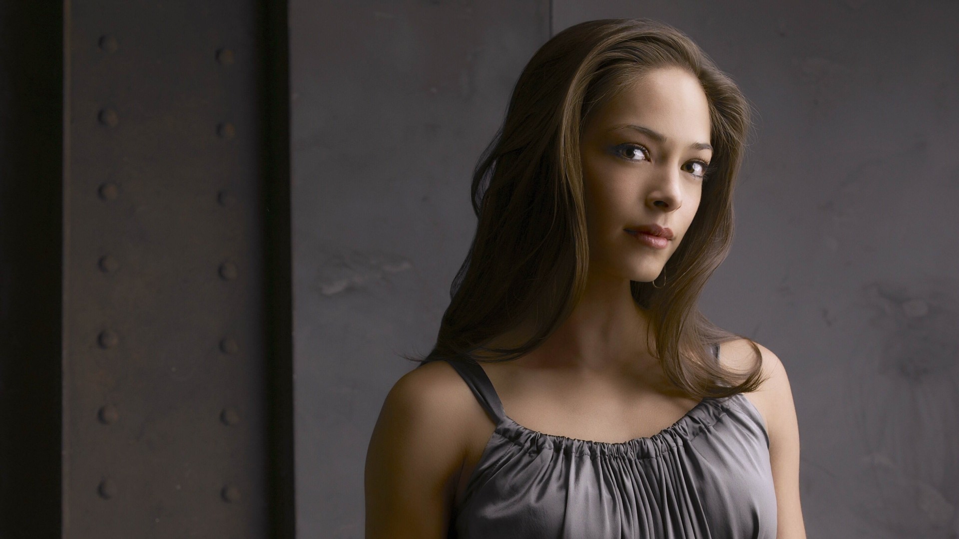 Kristin Kreuk in a gray dress