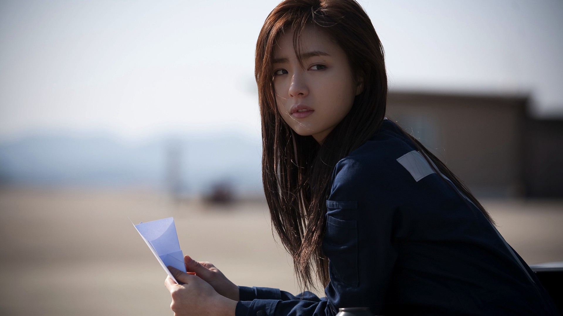 Japanese girl with paper in hand