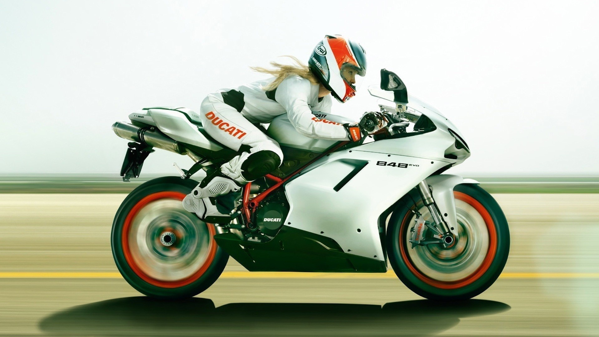 Blonde on a motorcycle Ducati