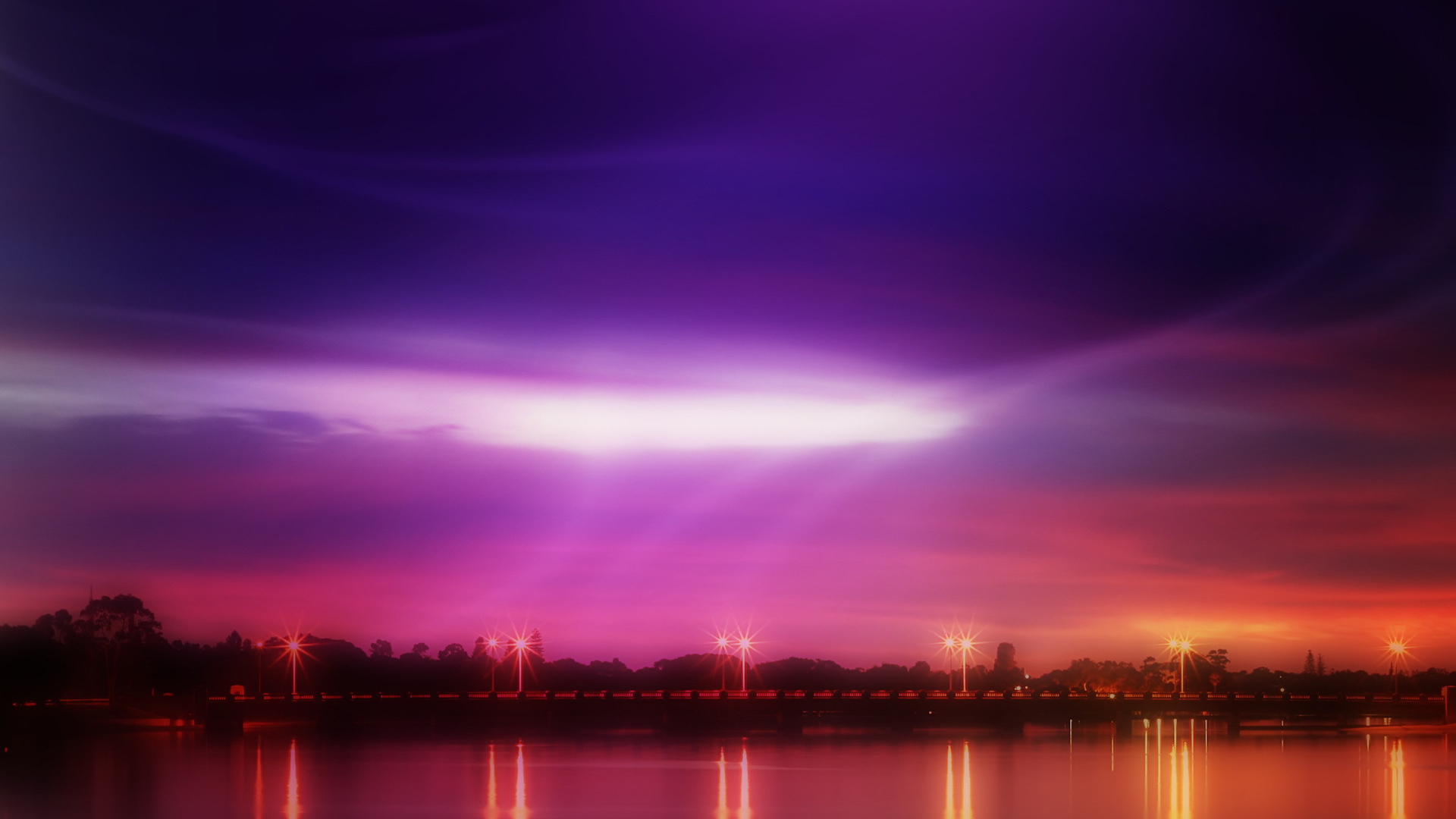 Розовый закат на берегу реки