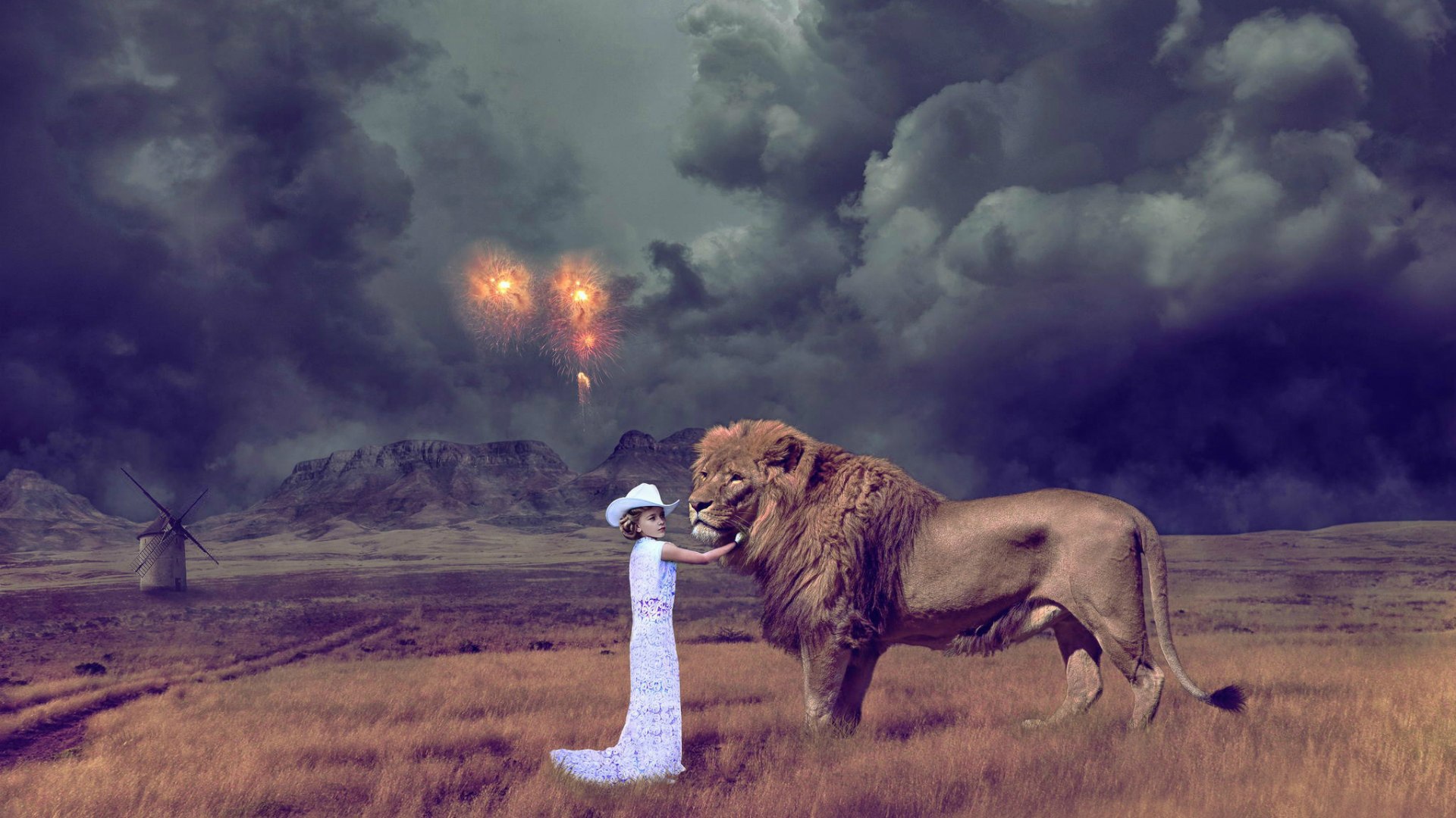 Девочка играет со львом