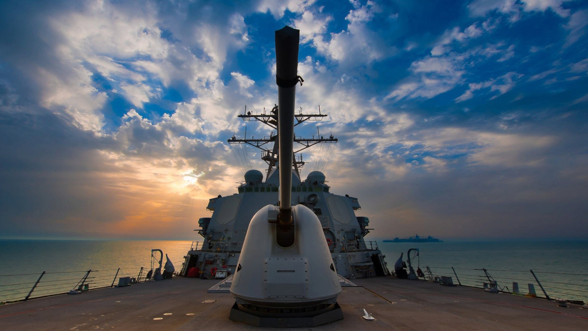 The cannon on the deck of a warship