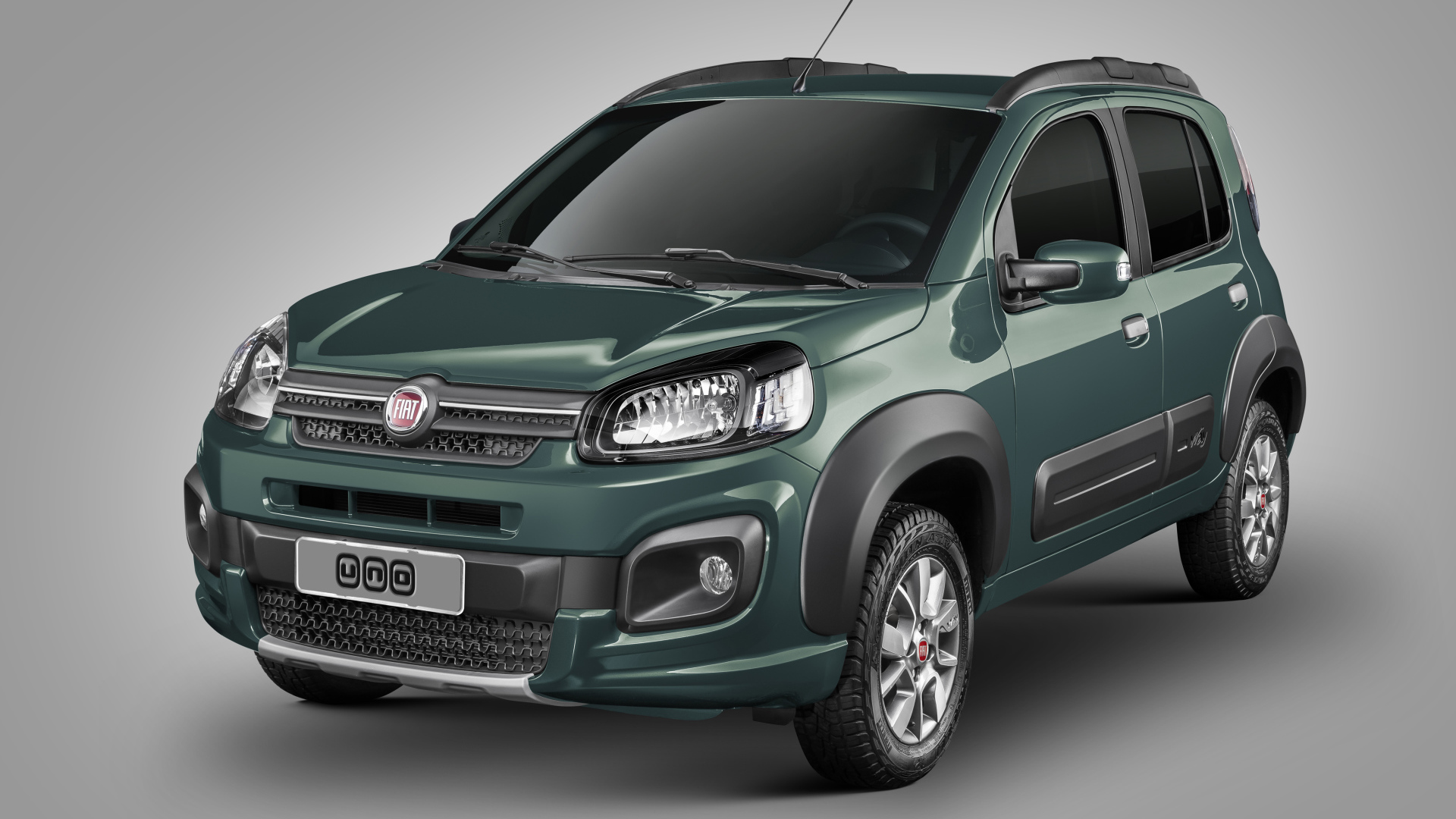 Зеленый автомобиль Fiat Uno Way на сером фоне