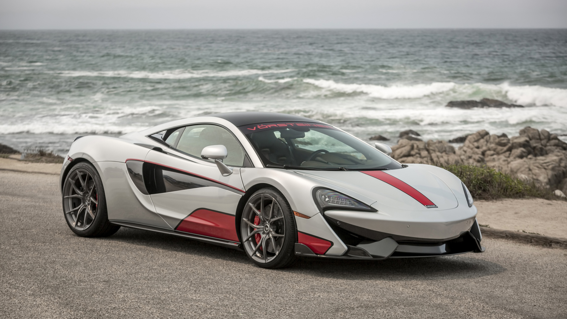 Sports car McLaren 570S on the background of the ocean