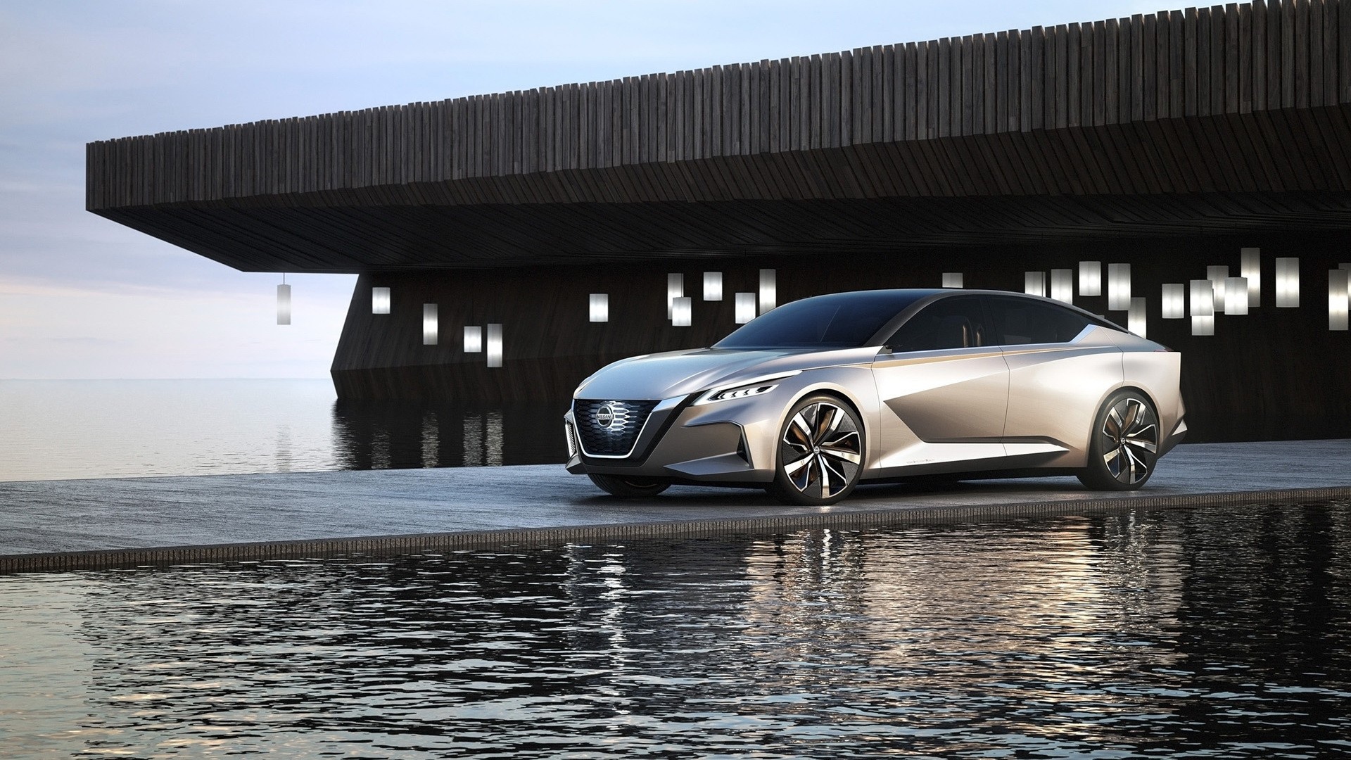 Серебристый автомобиль Nissan Vmotion 2.0 Concept, 2017 у воды 