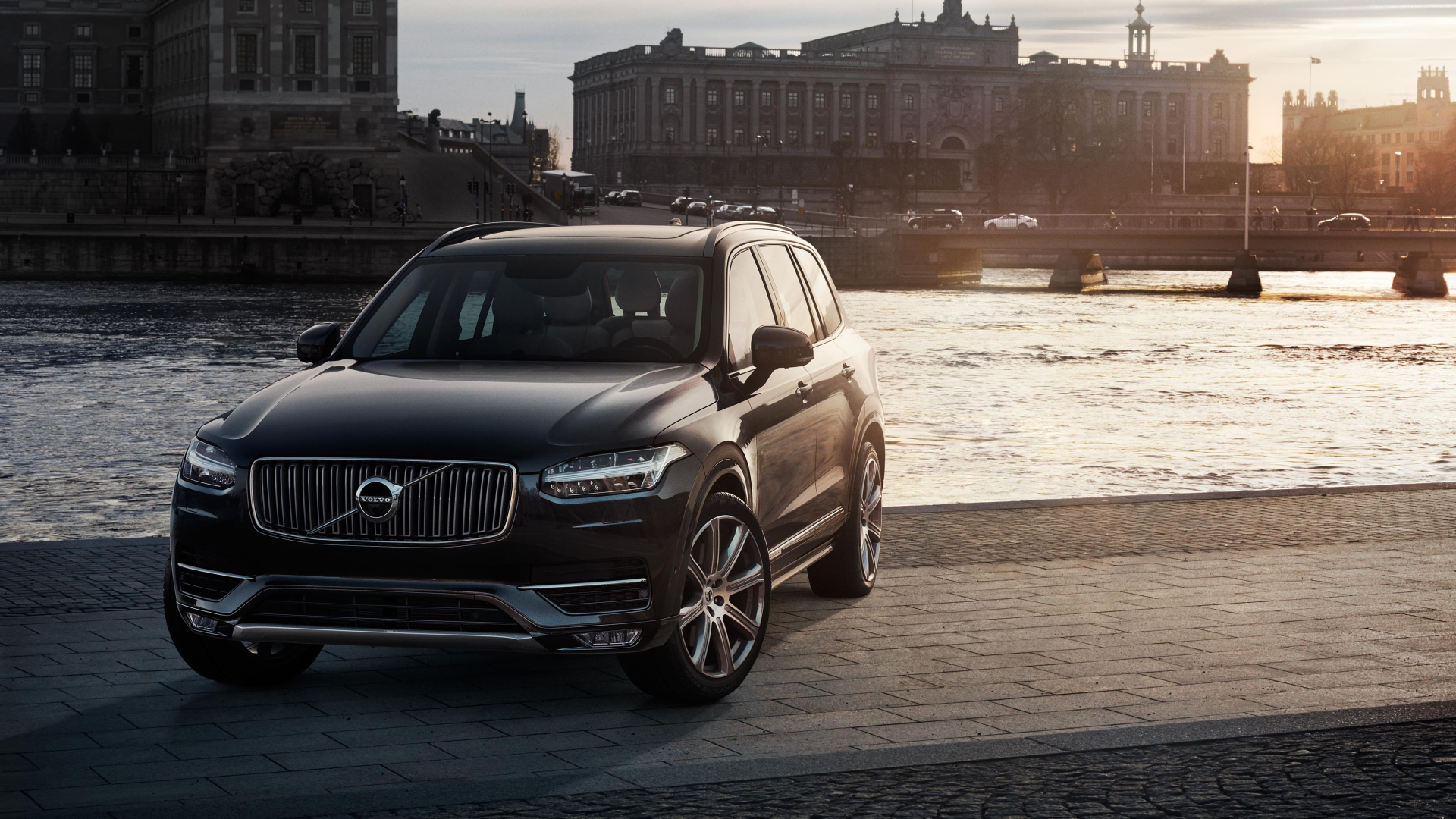 Black crossover Volvo XC90 at the river