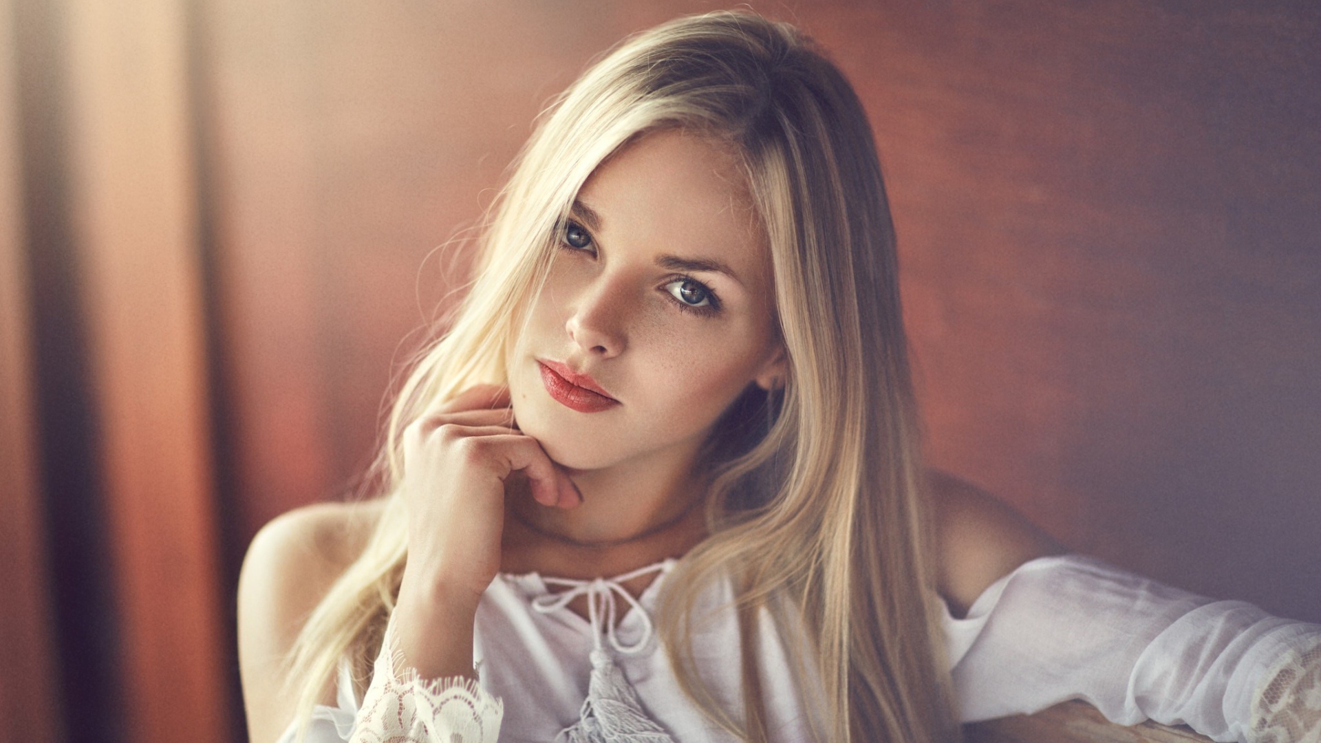 Elegant blonde girl in white dress