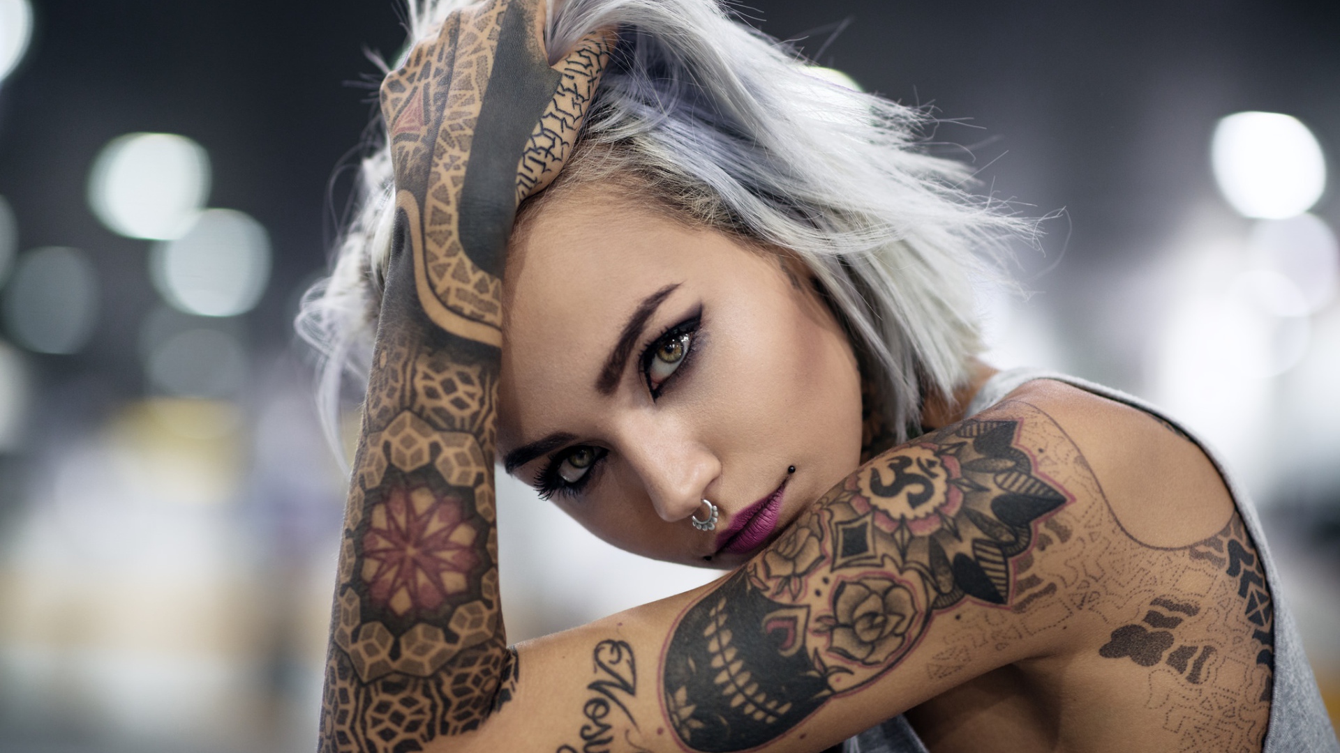 Young girl with tattoos on body