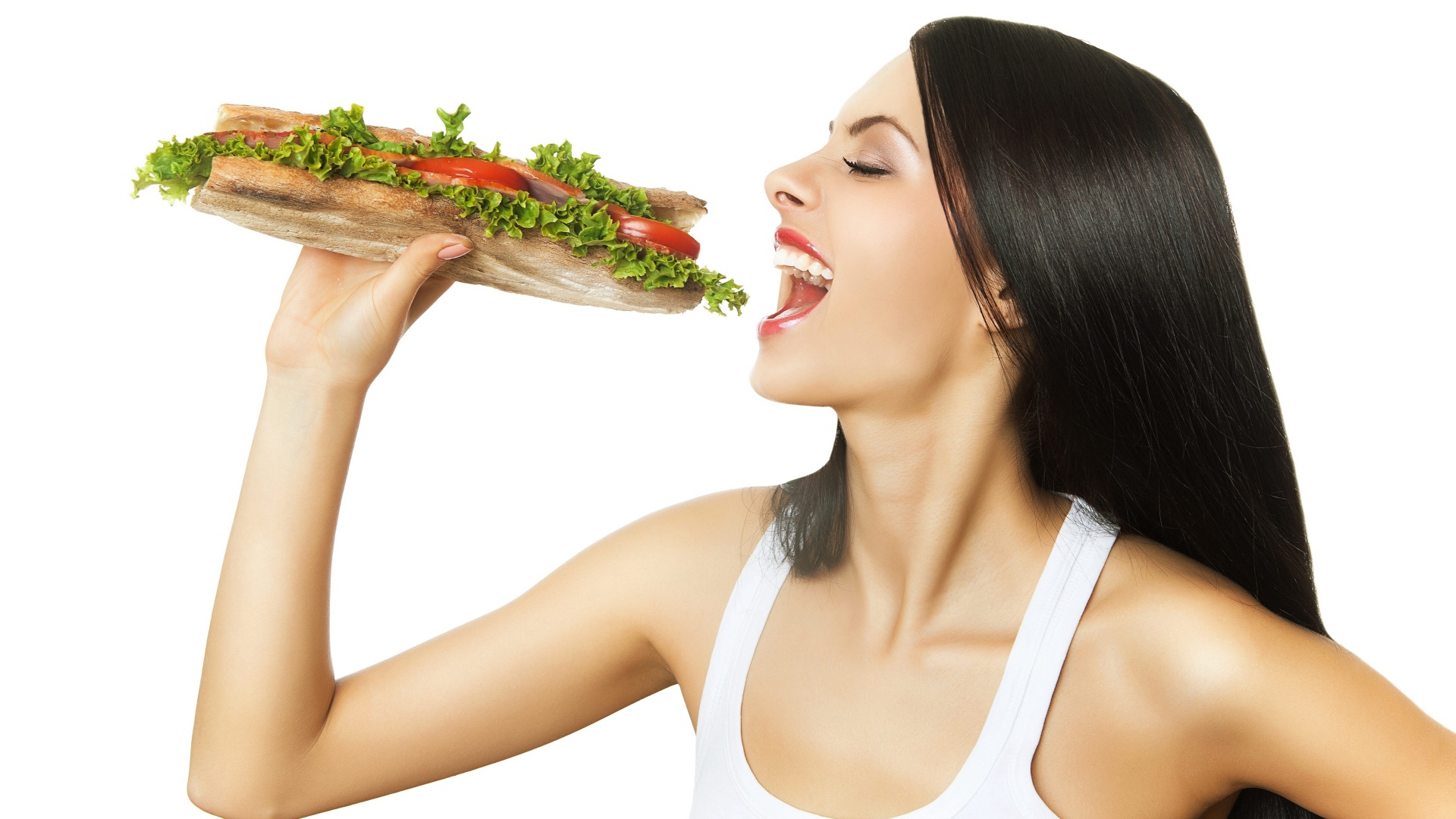 Beautiful long-haired brunette girl with a big sandwich