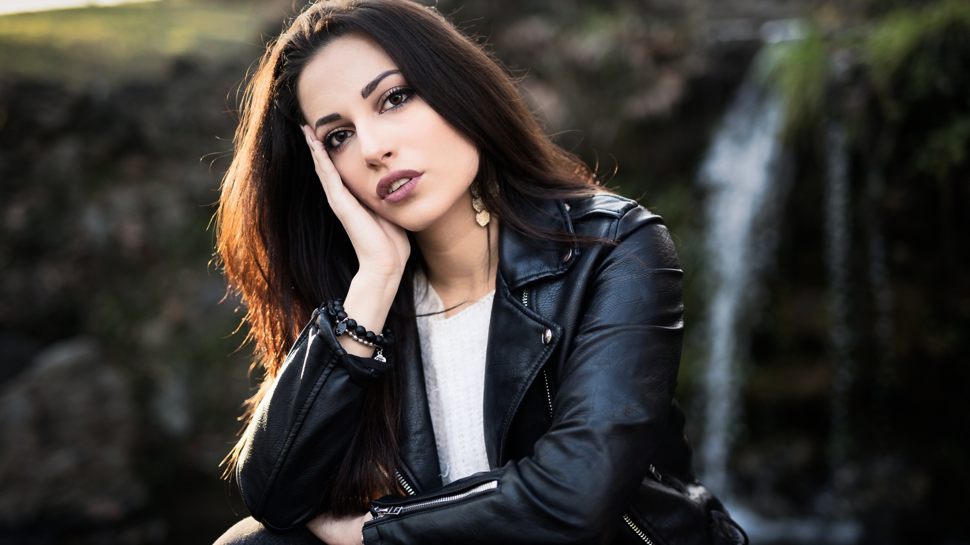 Stylish brunette in a black leather jacket
