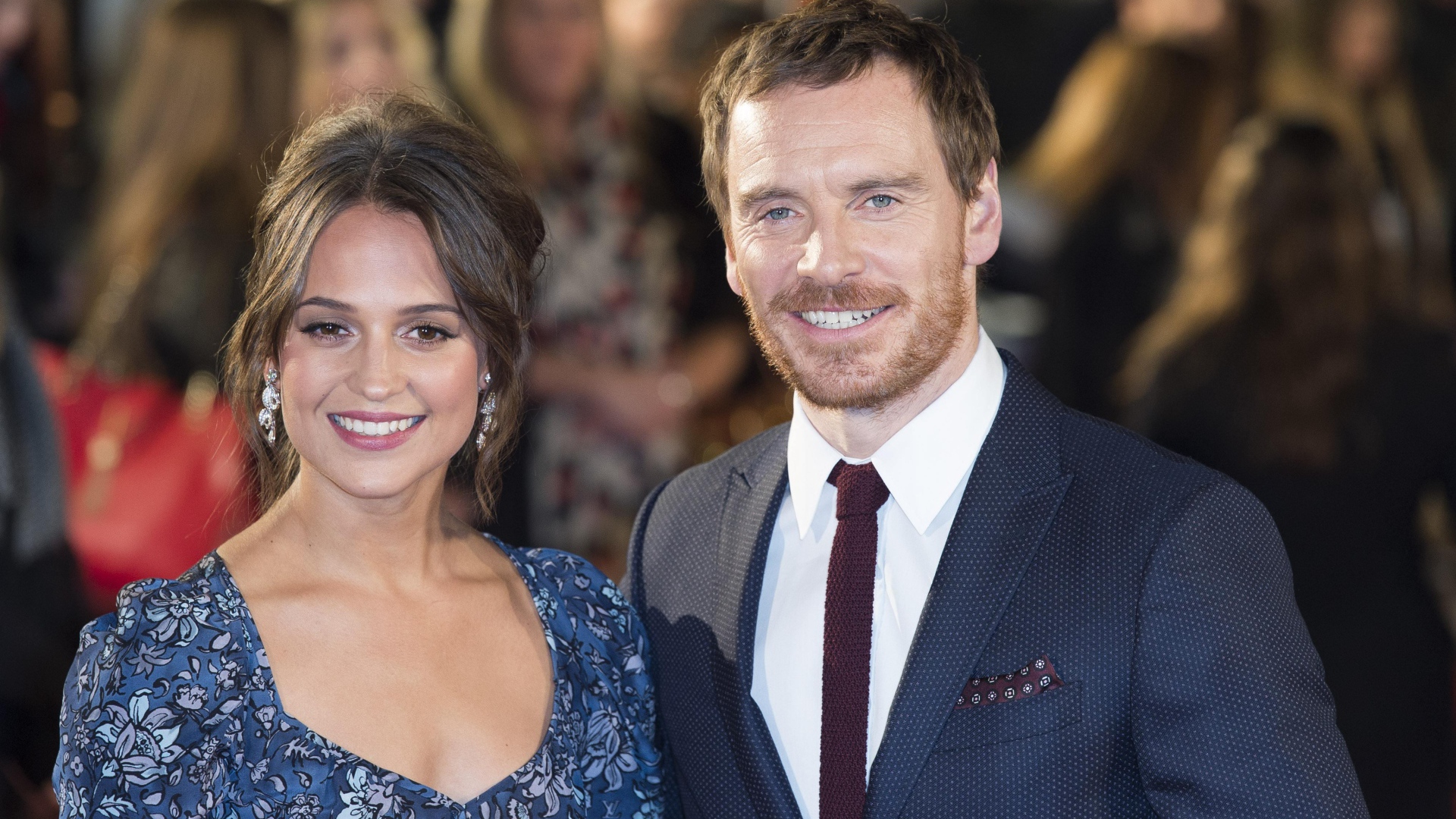 Smiling actors Alicia Wickander and Michael Fassbender
