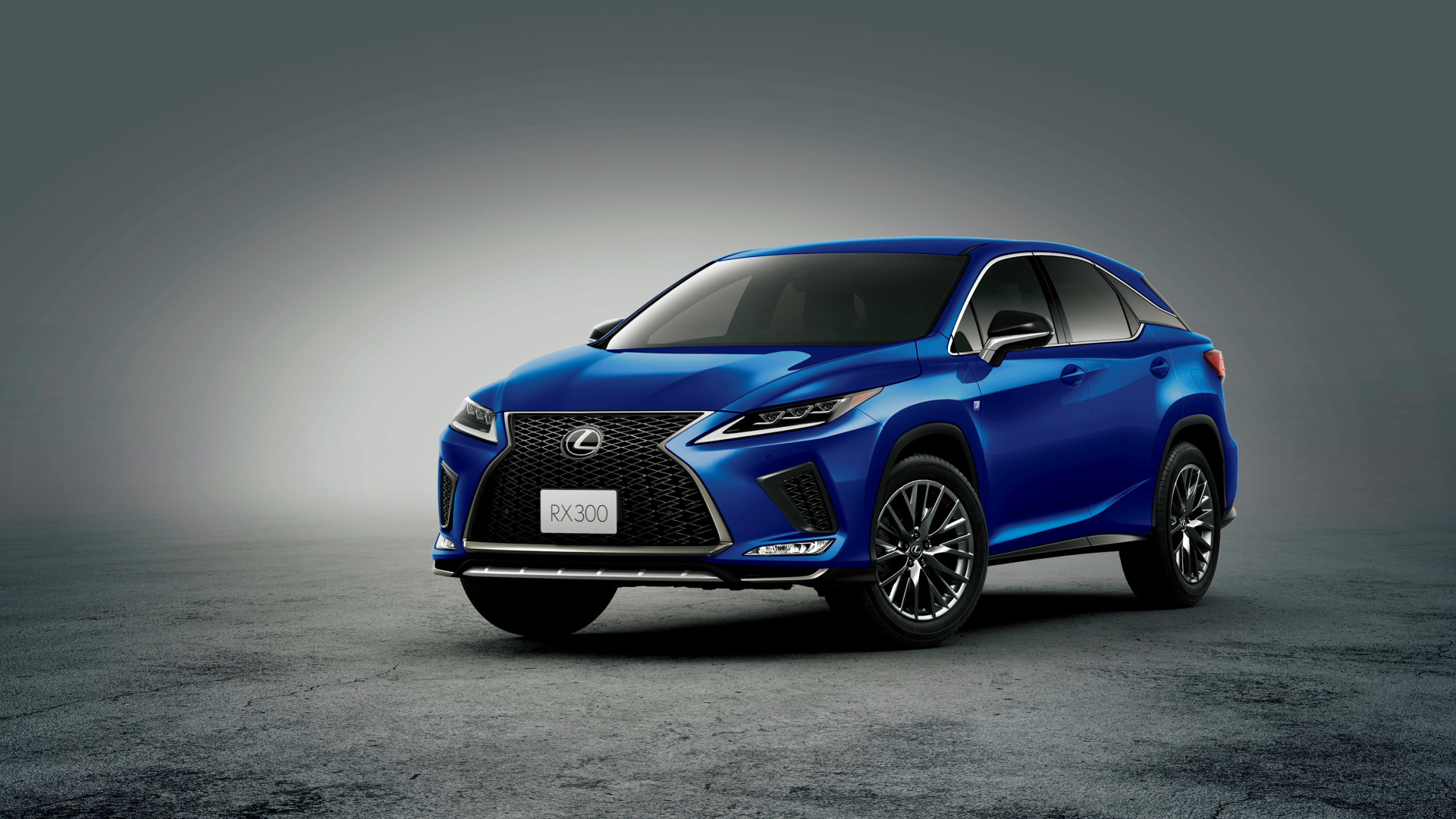 Синий автомобиль Lexus RX 300 F SPORT 2019 года на сером фоне