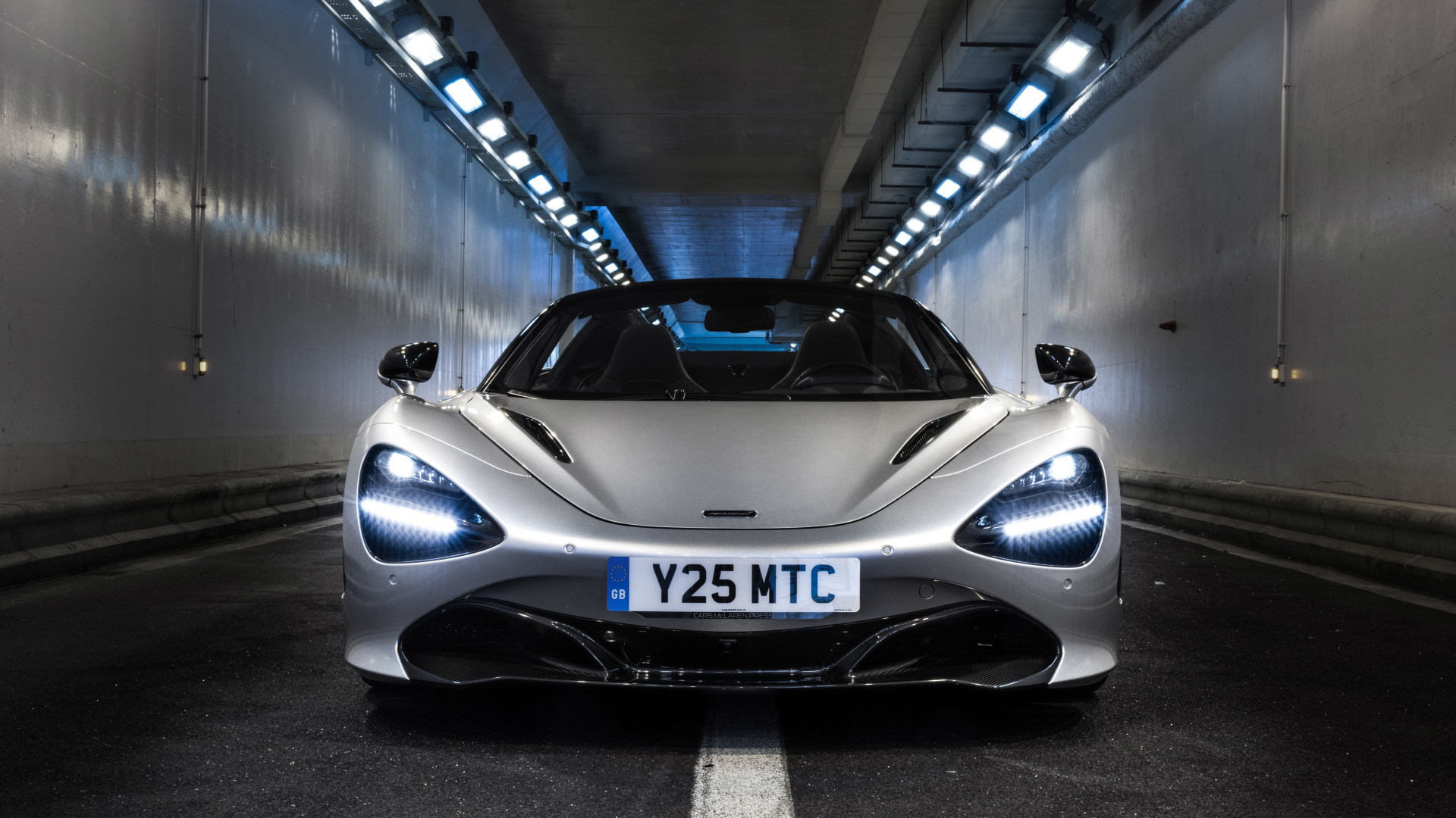 Silver sports car McLaren 720S Spider, 2019 in the tunnel