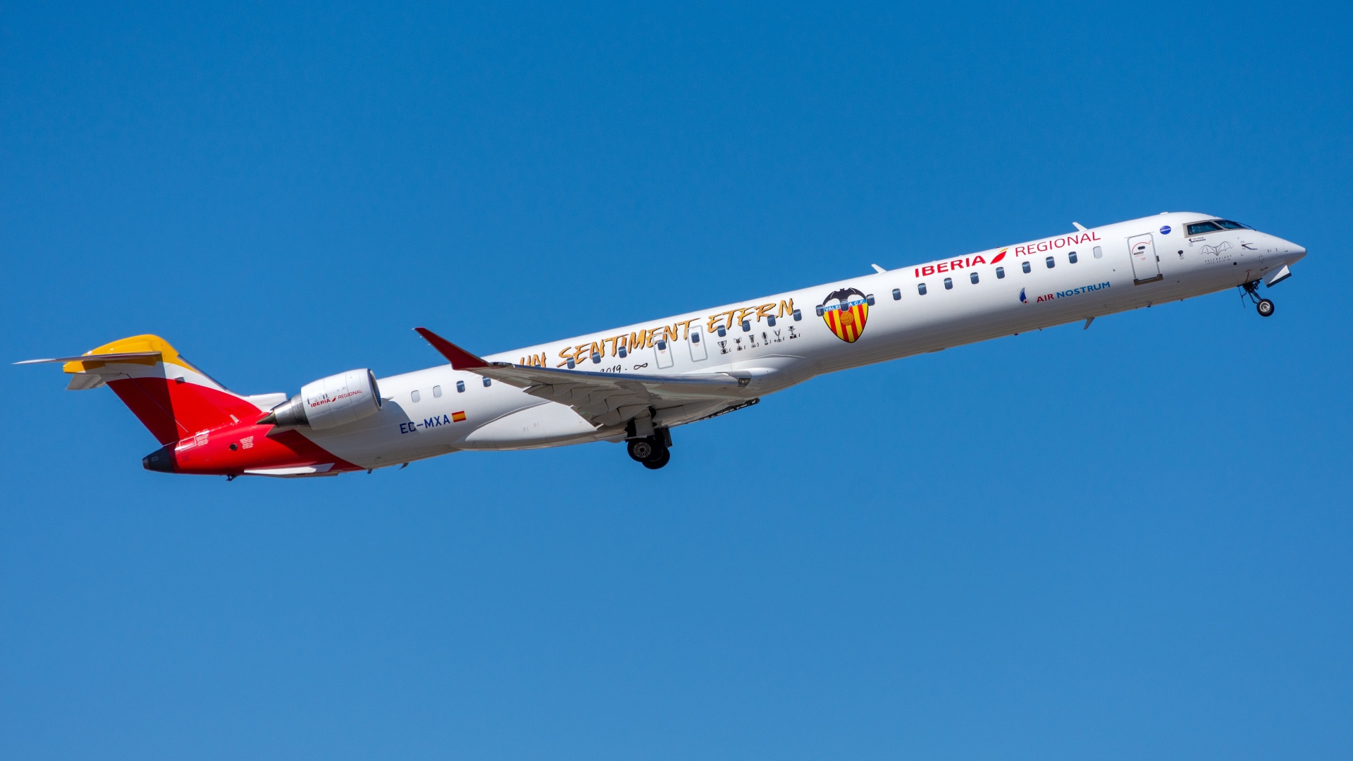Air Nostrum Bombardier CRJ-1000 aircraft against blue sky
