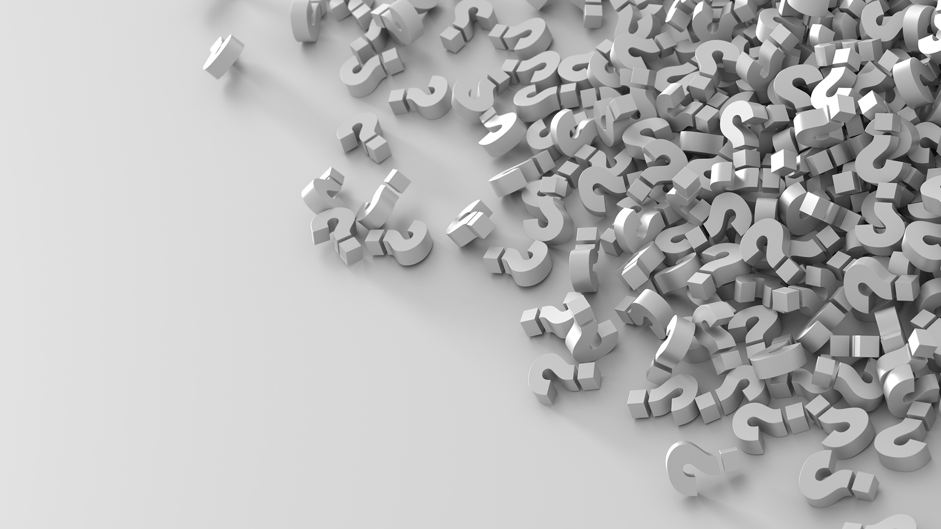 Много знаков вопроса на серой поверхности 