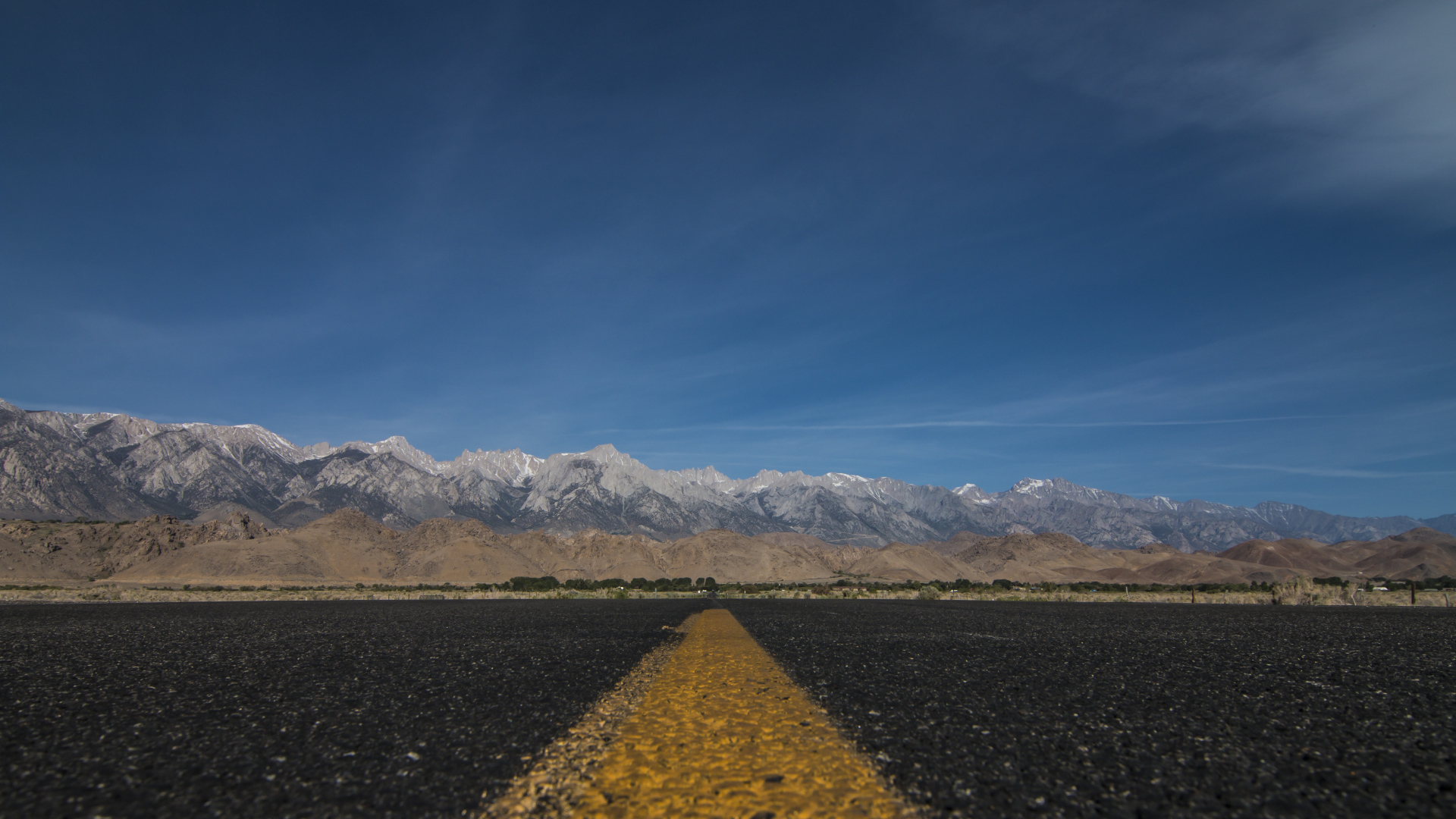 Asphalt road on a background of mountains