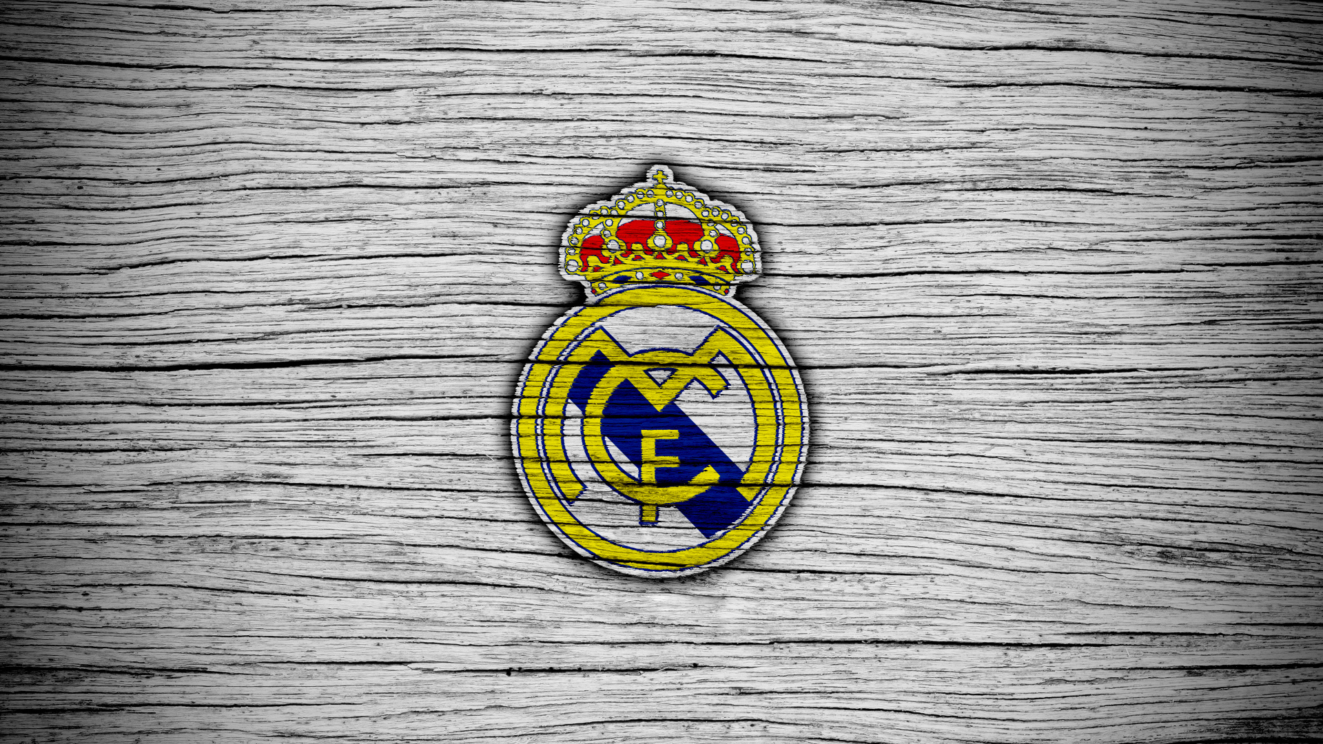 Логотип футбольного клуба Реал Мадрид на сером фоне