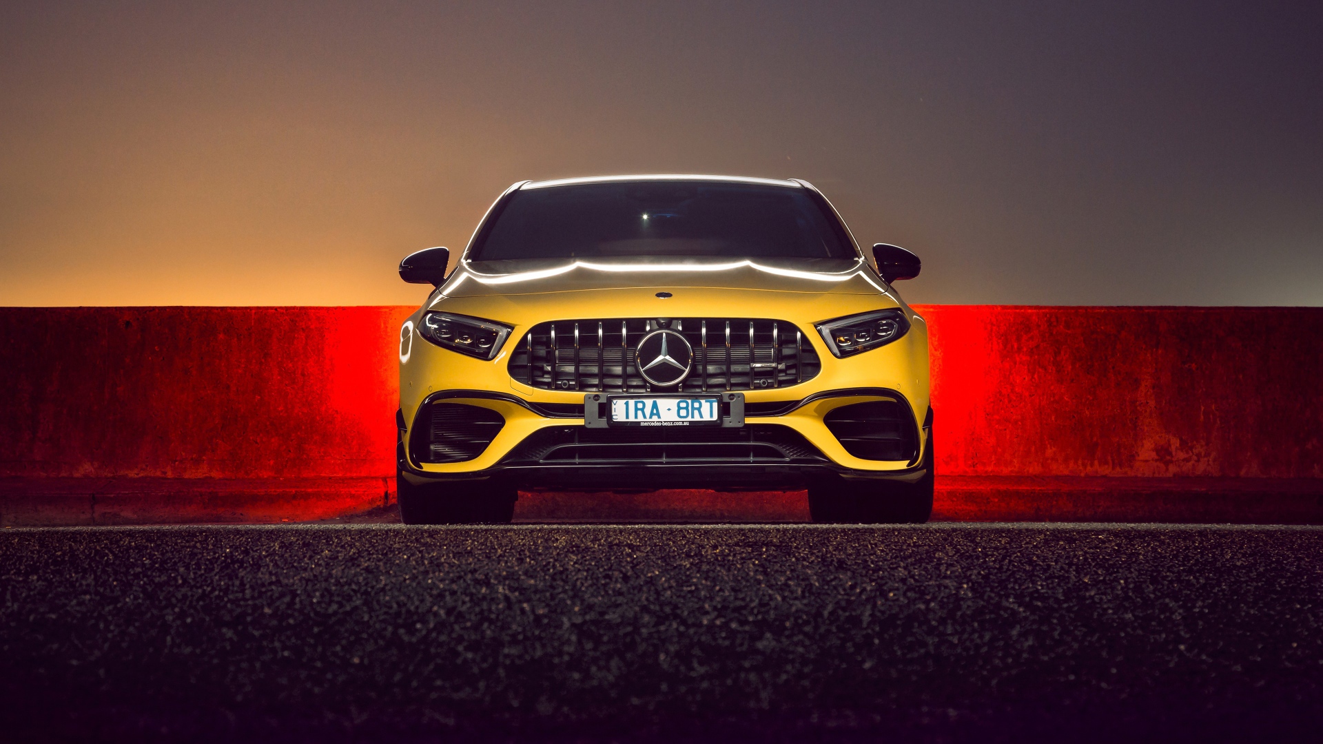 Желтый автомобиль Mercedes-AMG A 45 S,  2020 года вид спереди