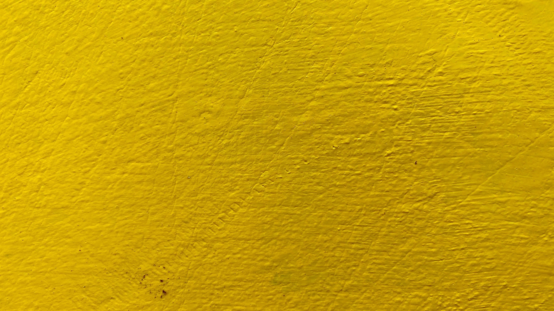 The wall is painted yellow, background