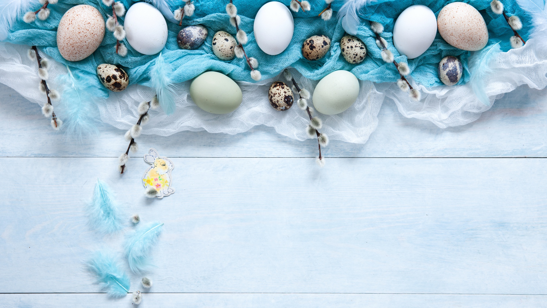Eggs on fabric with willow branches on the table