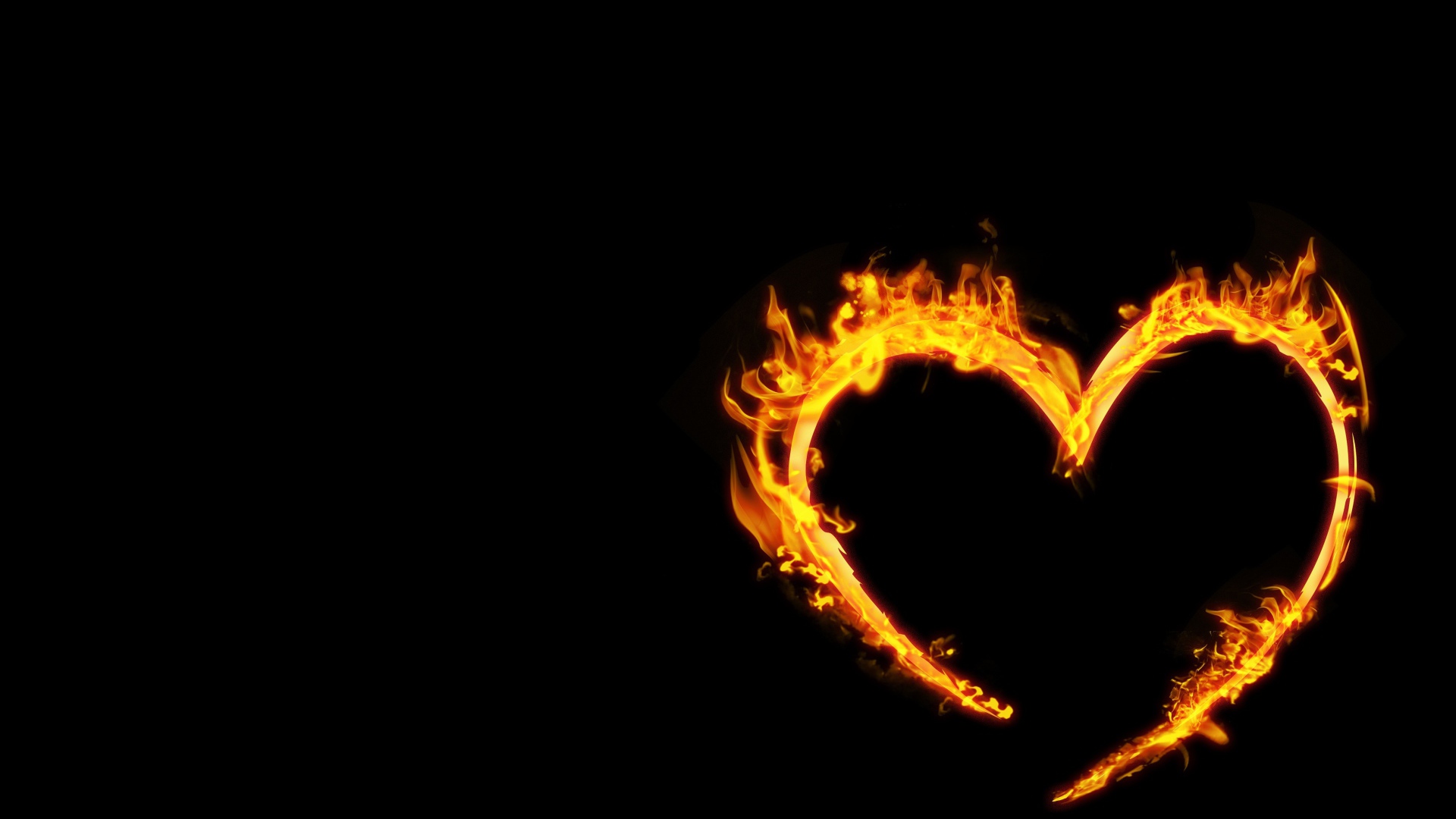 Яркое огненное сердце на черном фоне