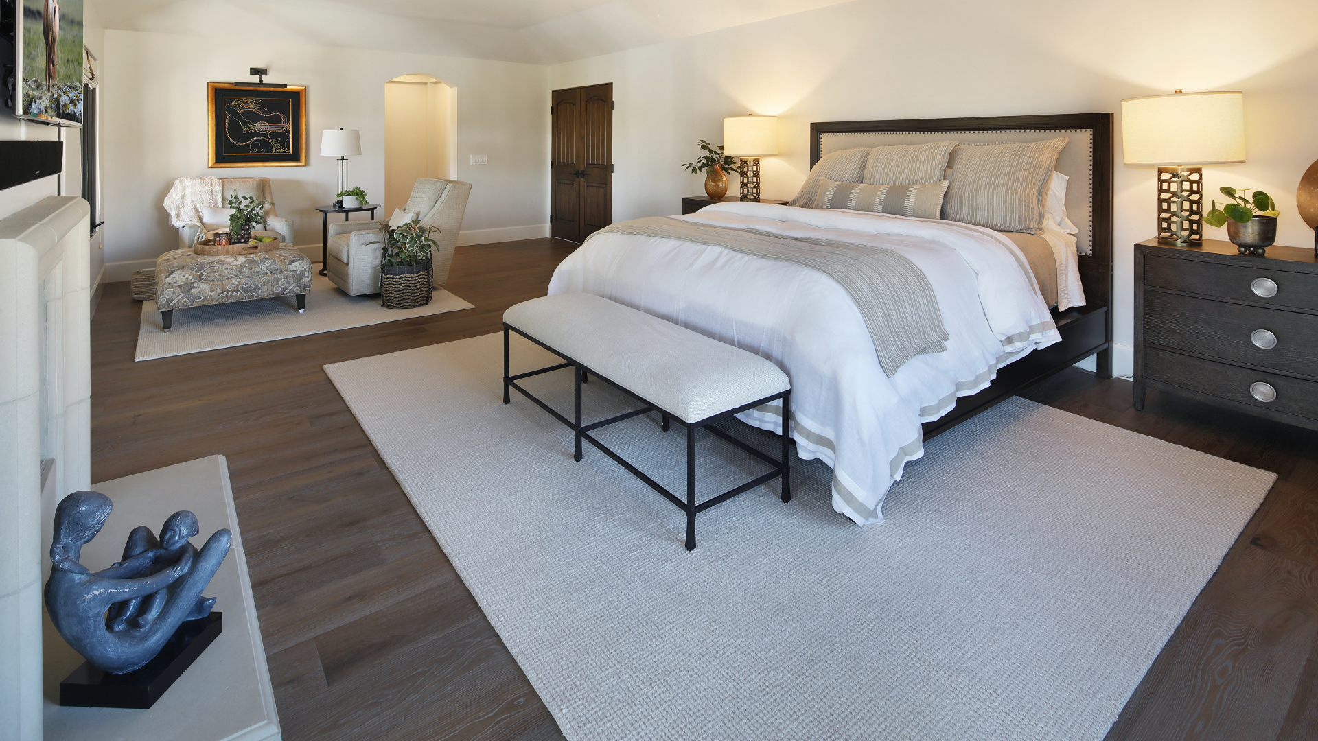 Large bright bedroom with a bed and furniture