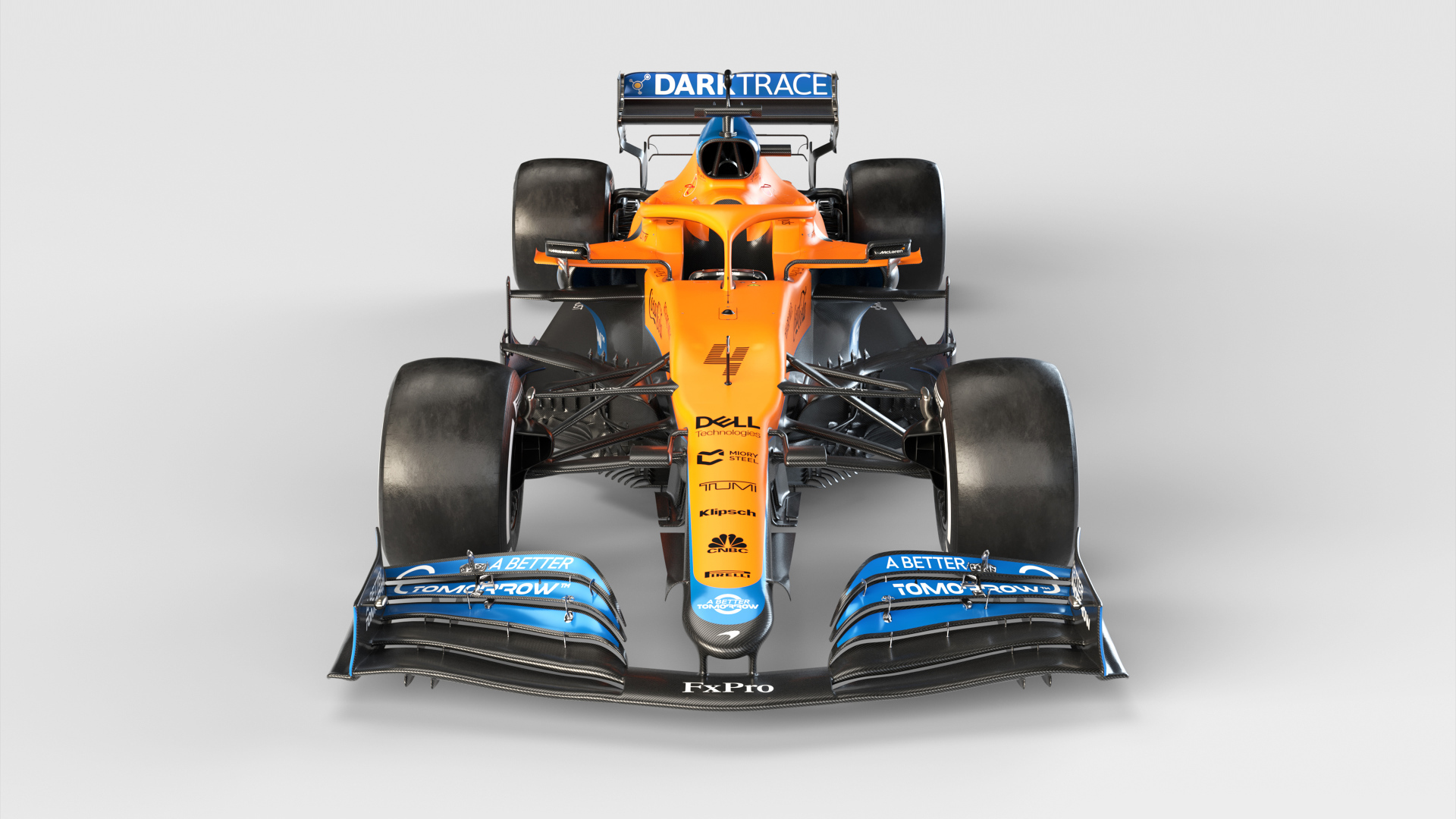 Гоночный автомобиль McLaren MCL35M 2021 года на сером фоне