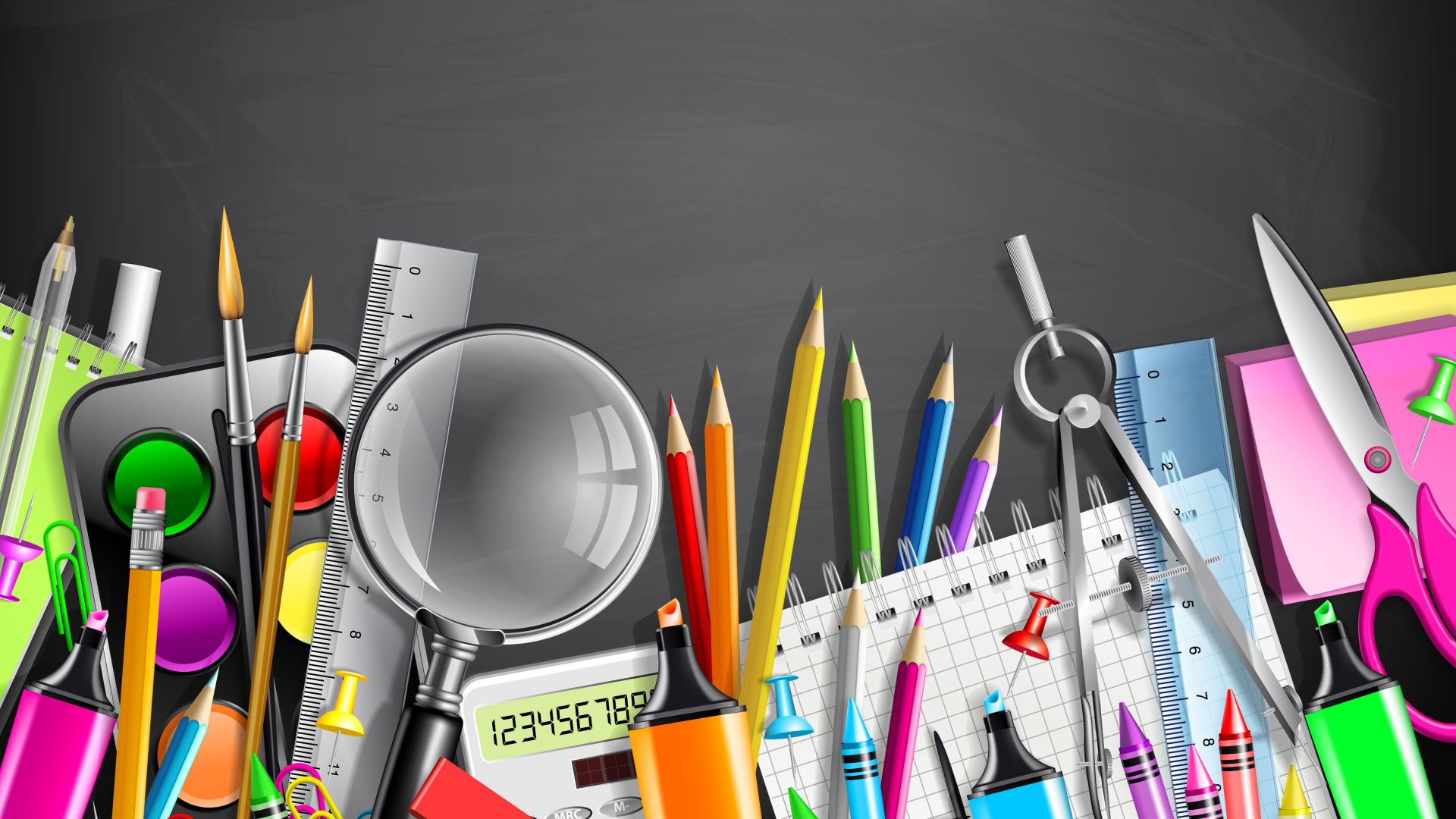 Разноцветные канцелярские предметы на сером фоне